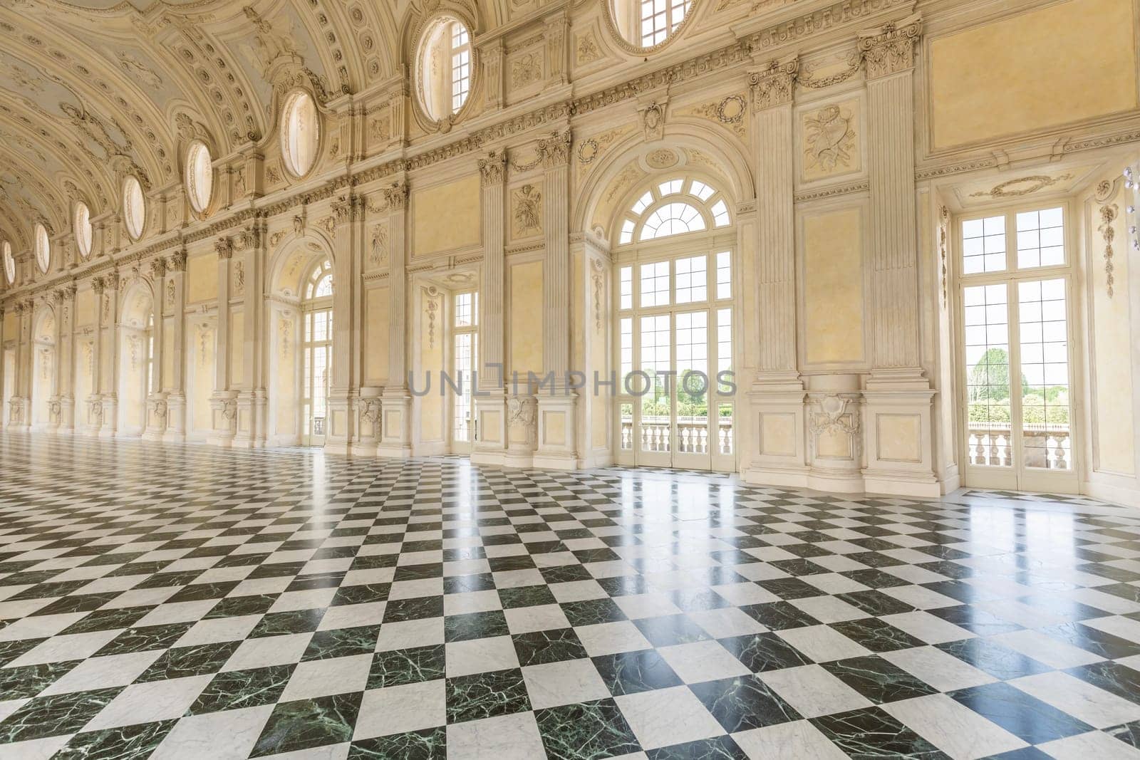 VENARIA REALE, ITALY - CIRCA MAY 2021: corridor with floor made of luxury marbles. Plenty of elegance for this Italian interior in Venaria Reale, Piedmont region.