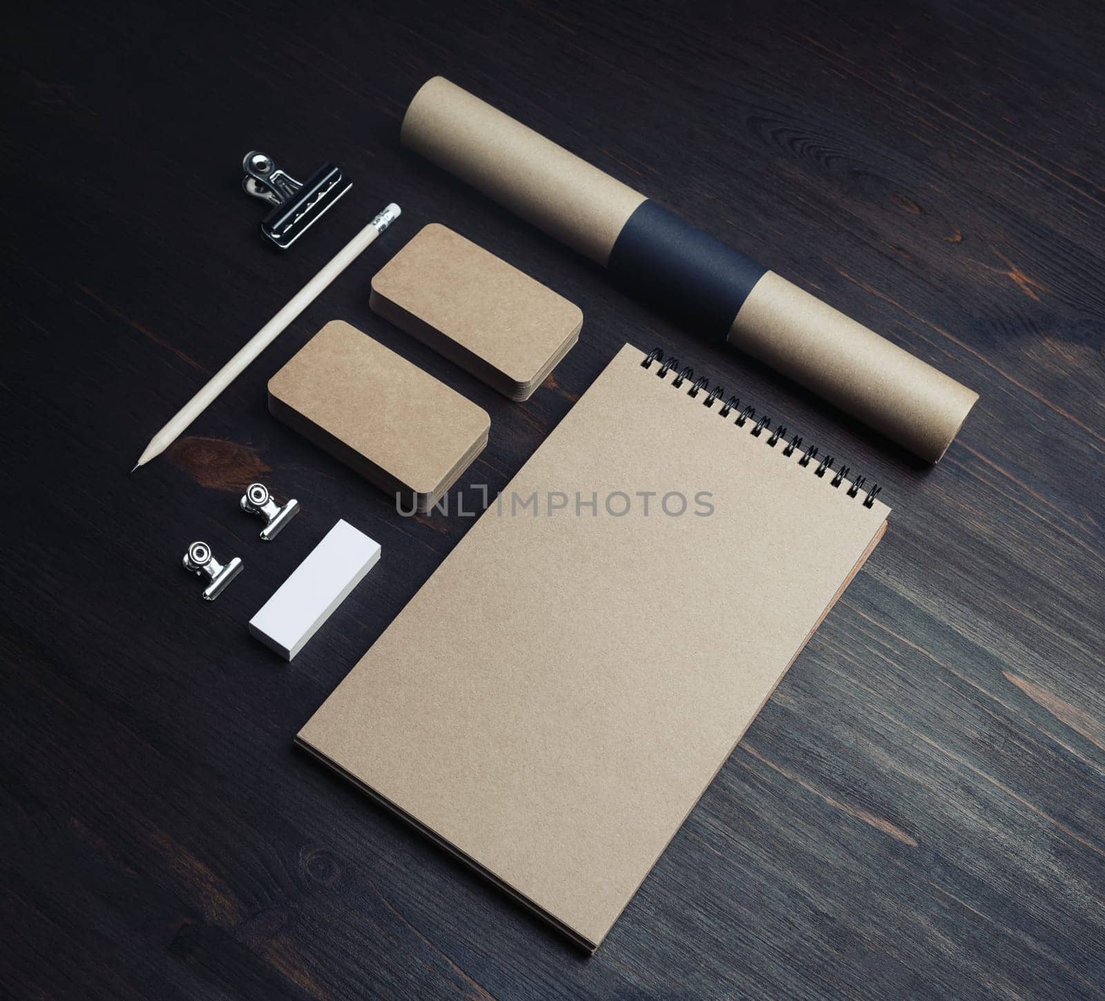 Blank vintage stationery set on wood table background. Responsive design mockup.