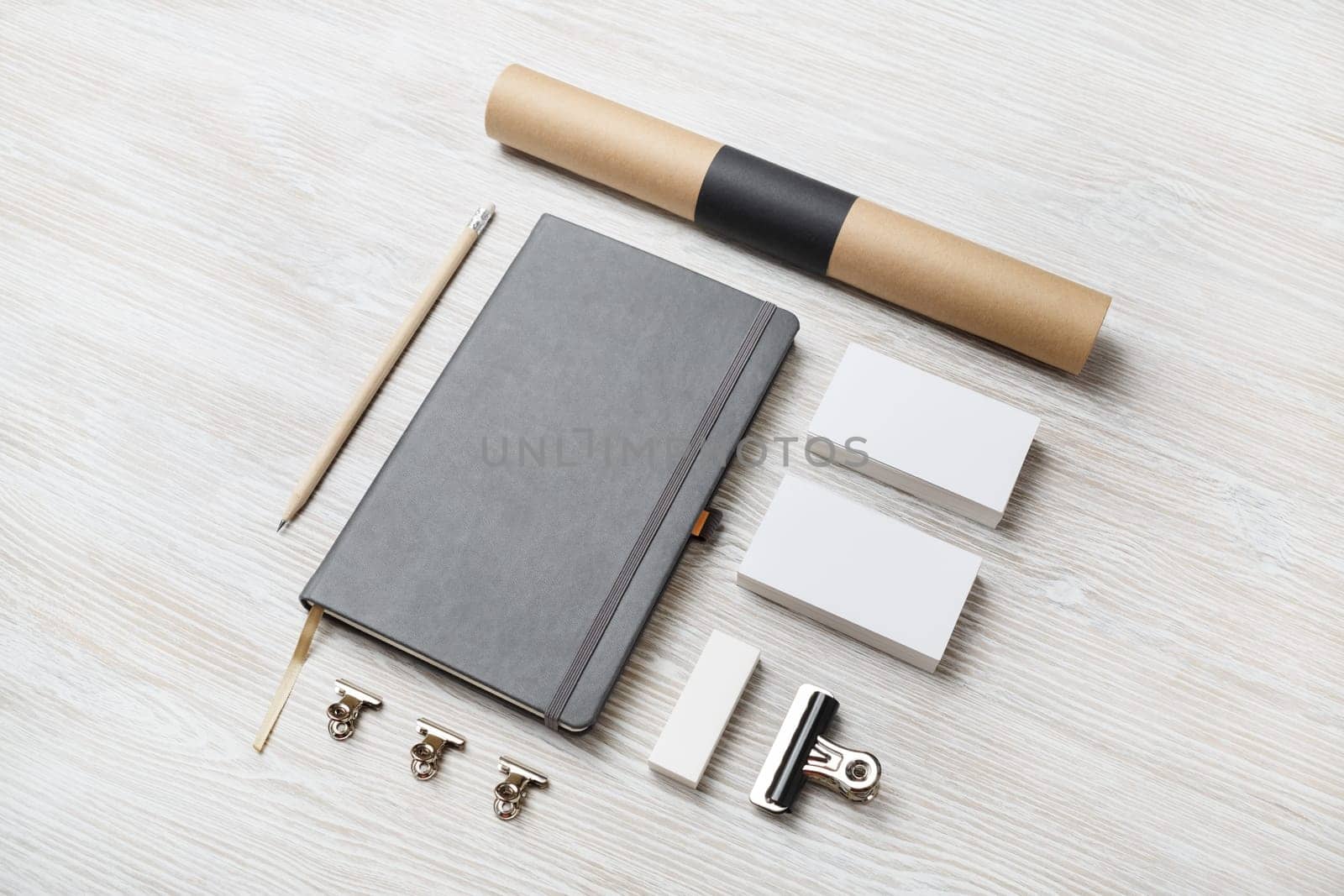 Photo of blank stationery set on light wooden background. Corporate identity mock up.
