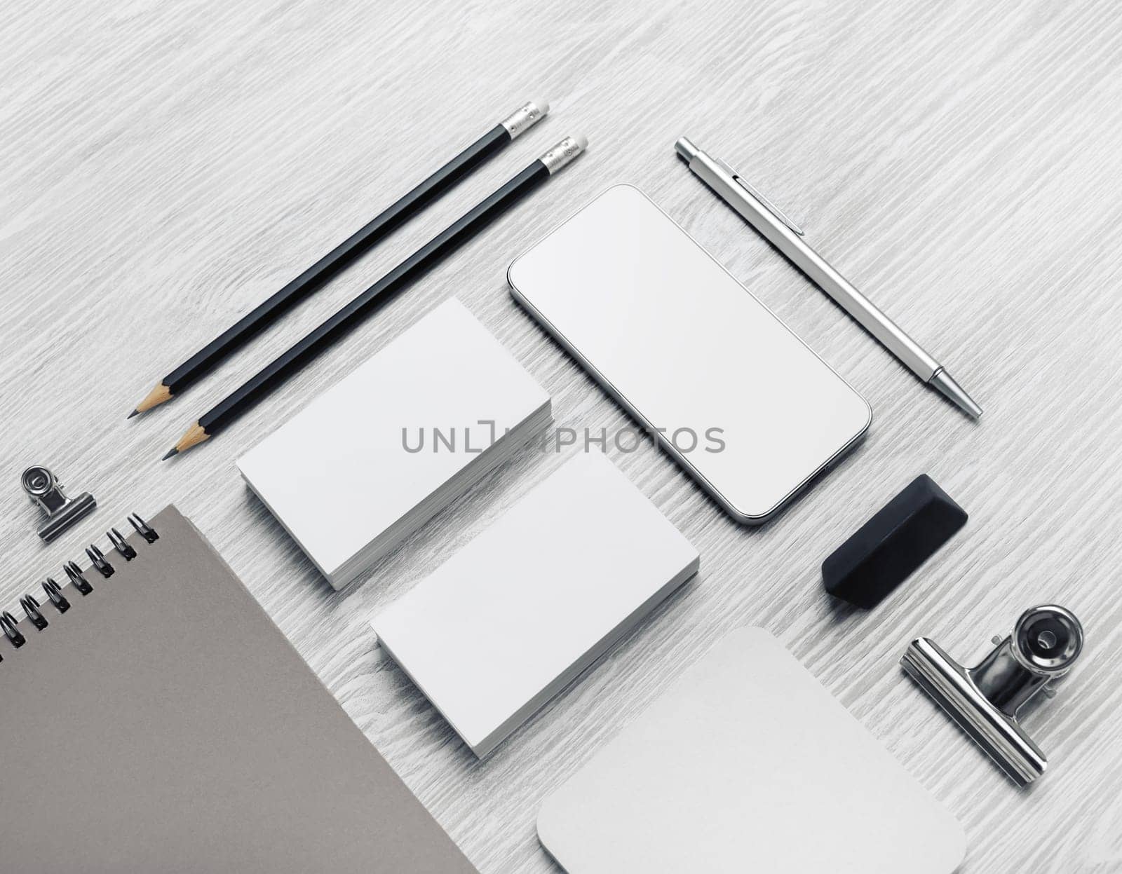 Blank corporate identity template on light wood table background. Photo of blank stationery set. Mockup for design presentations and portfolios.