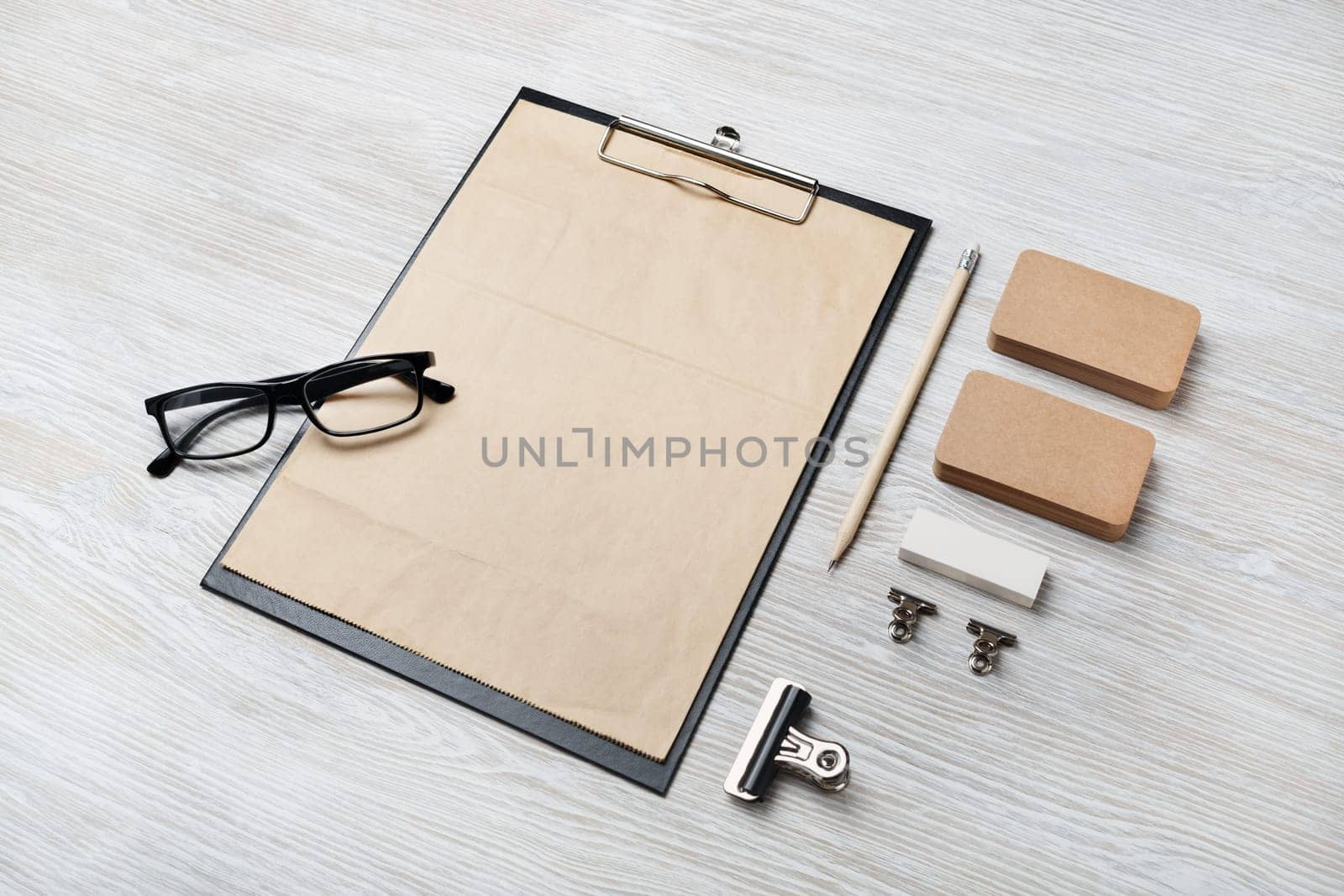 Blank vintage corporate stationery set on light wooden background. Template for branding identity.
