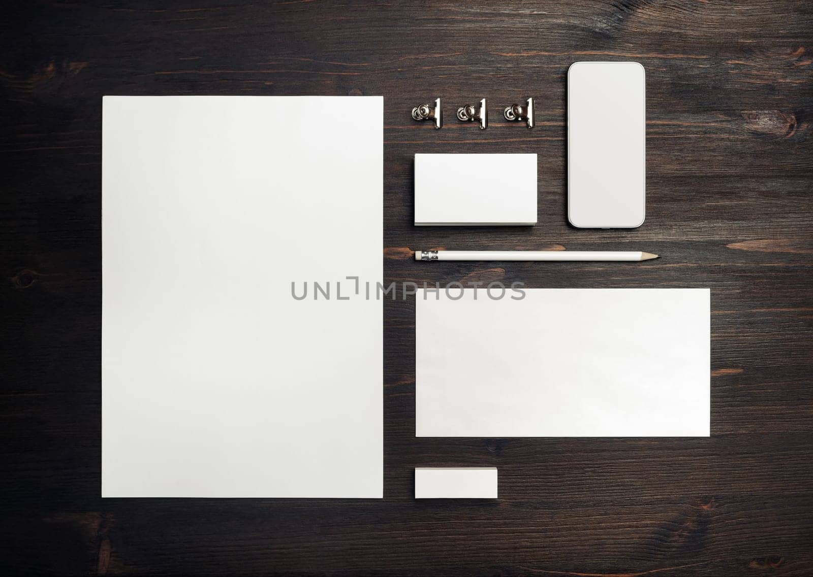 Blank stationery template on wooden background. Mock-up for branding identity. For design presentations and portfolios. Top view. Flat lay.