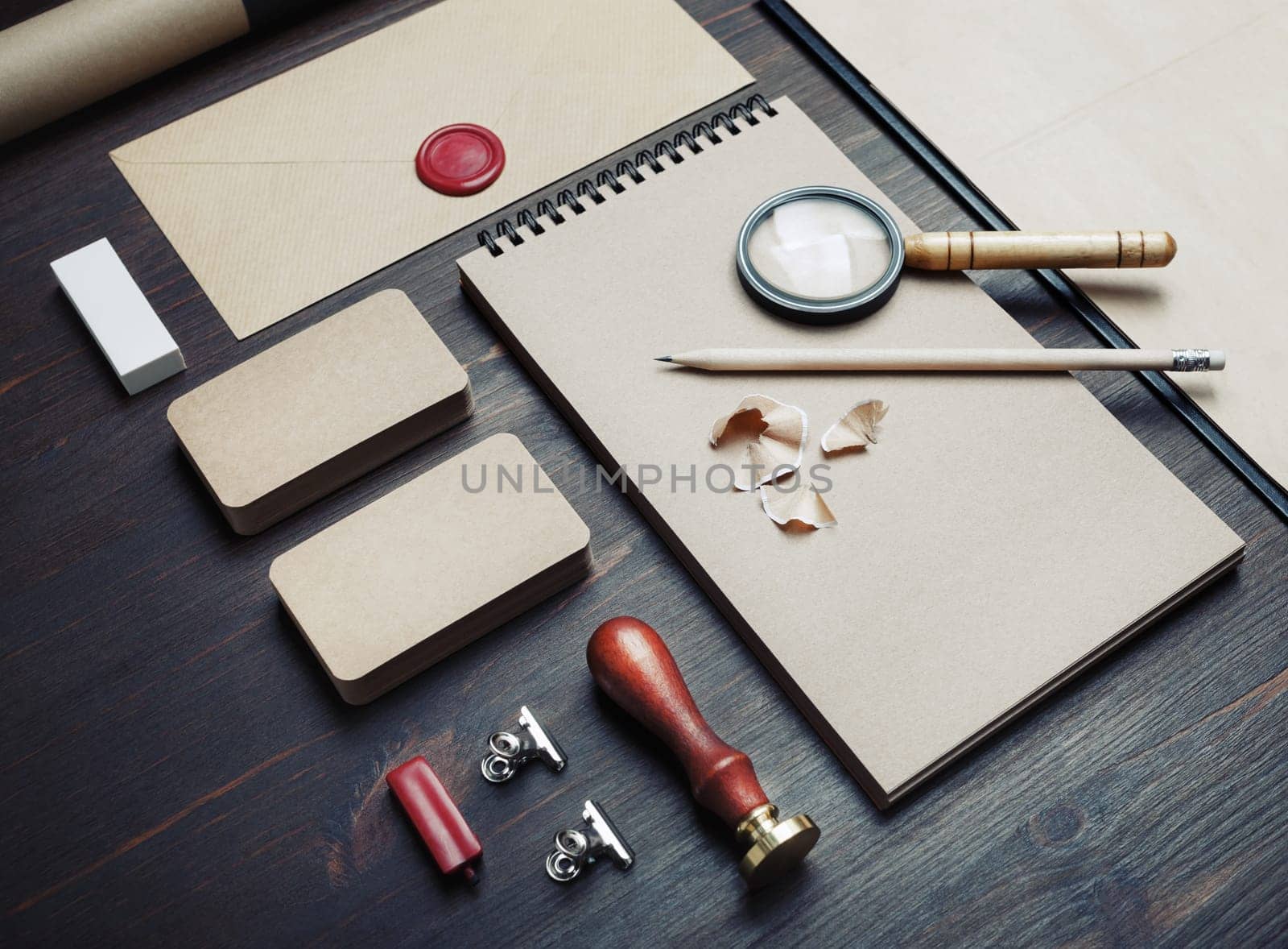 Blank kraft business stationery set on wood table background. Corporate identity template. Branding mock-up.