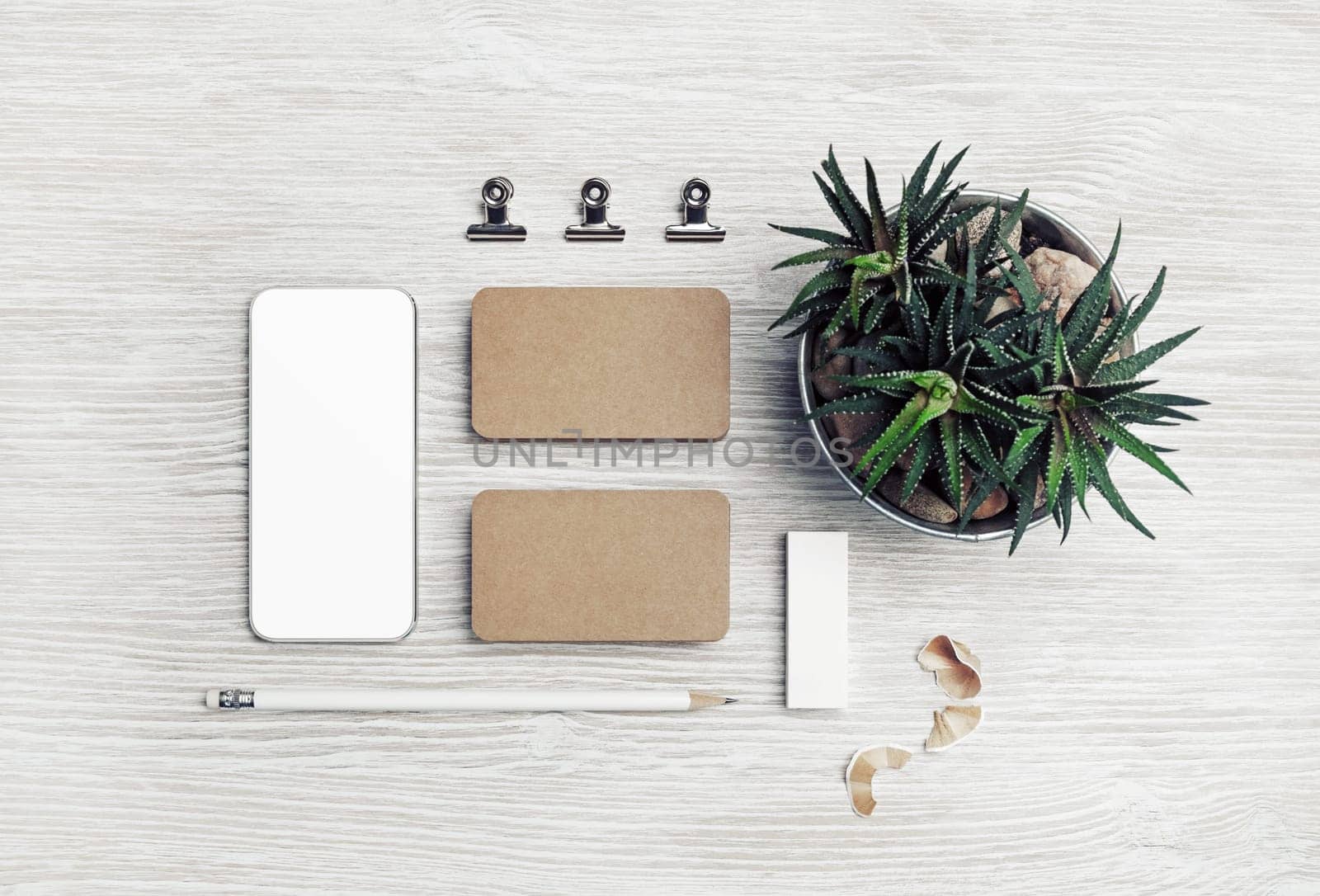 Blank stationery template on light wooden background. Corporate identity set. Top view. Flat lay.