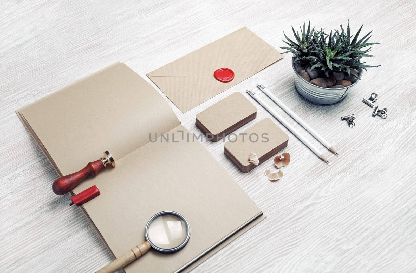 Blank vintage stationery and ID template on light wood table background. Mock-up for branding identity for designers.