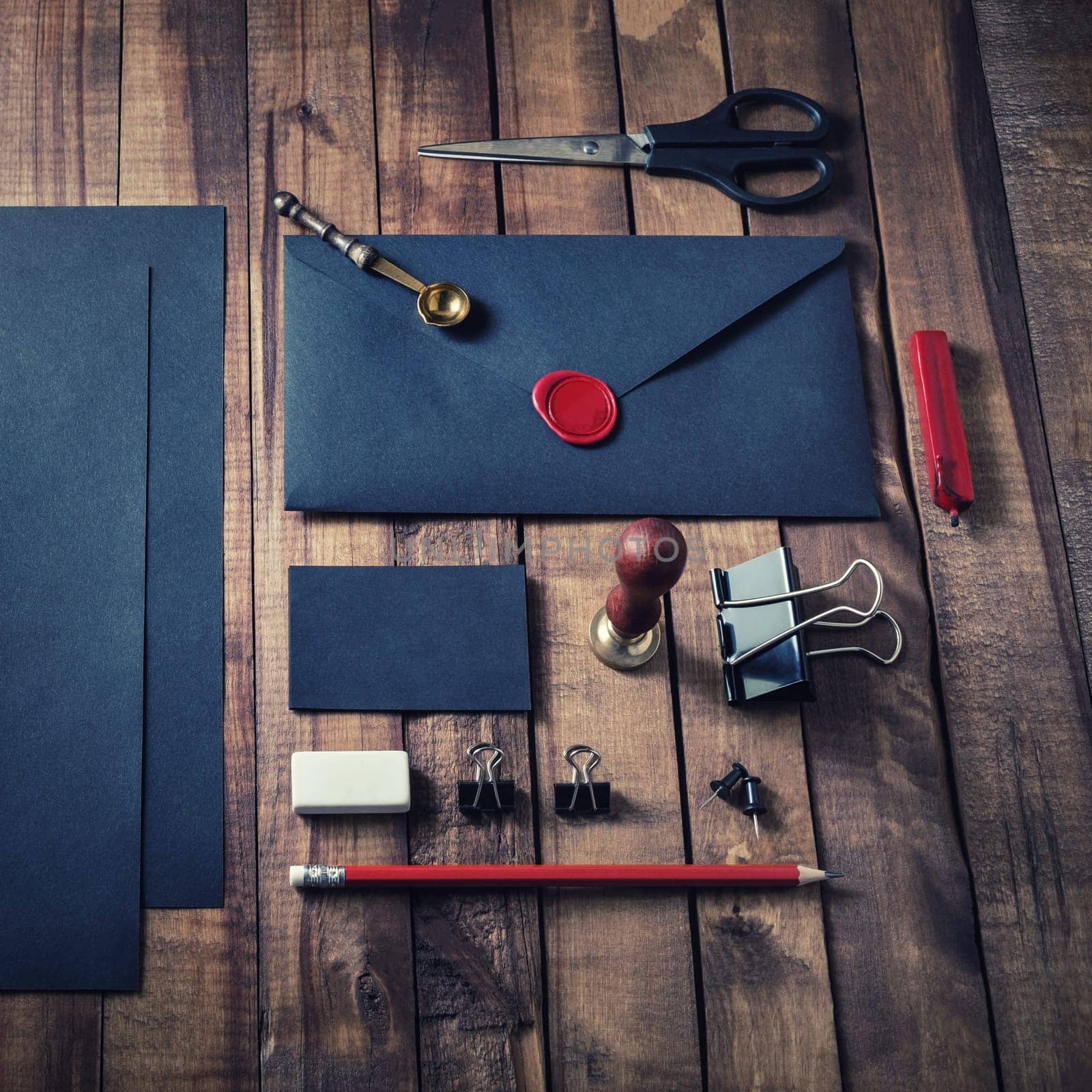 Blank black stationery set on vintage wood table background. Mock up for branding identity. ID template.