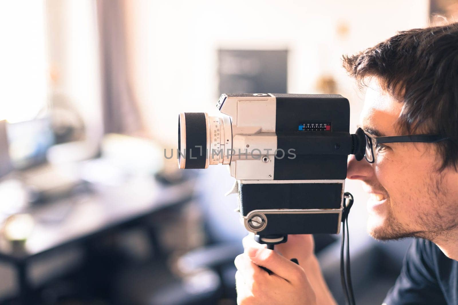 Filmmaker is doing a movie, vintage old movie camera