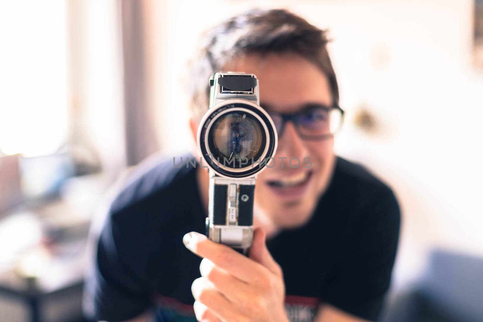Filmmaker is doing a movie, vintage old movie camera
