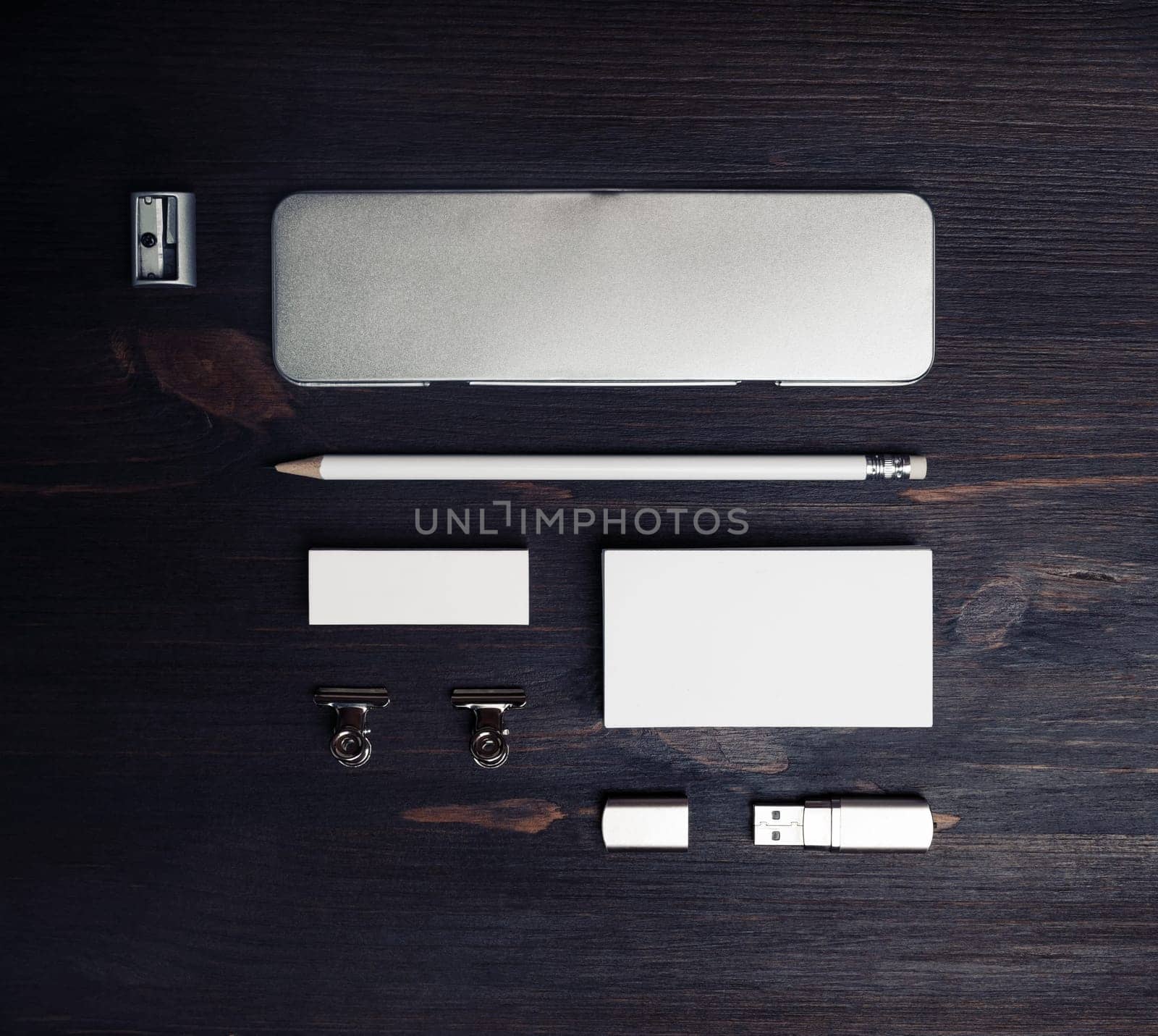 Blank corporate stationery set on wood table background. Template for branding identity. Flat lay.