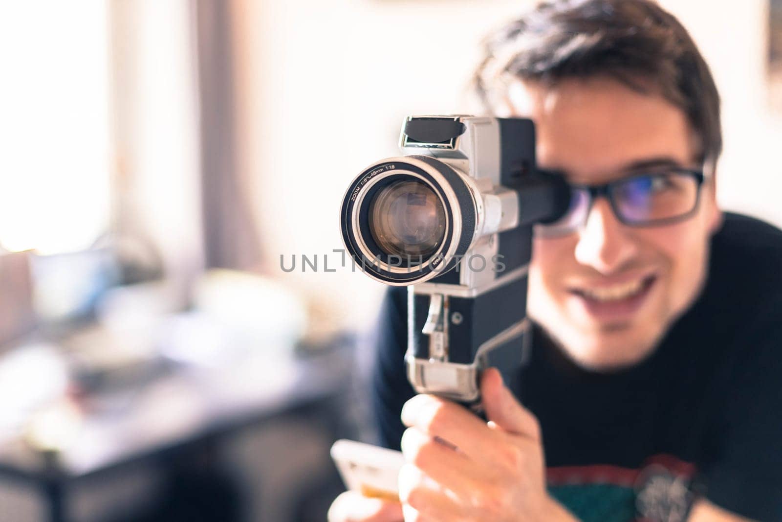 Filmmaker is doing a movie, vintage old movie camera