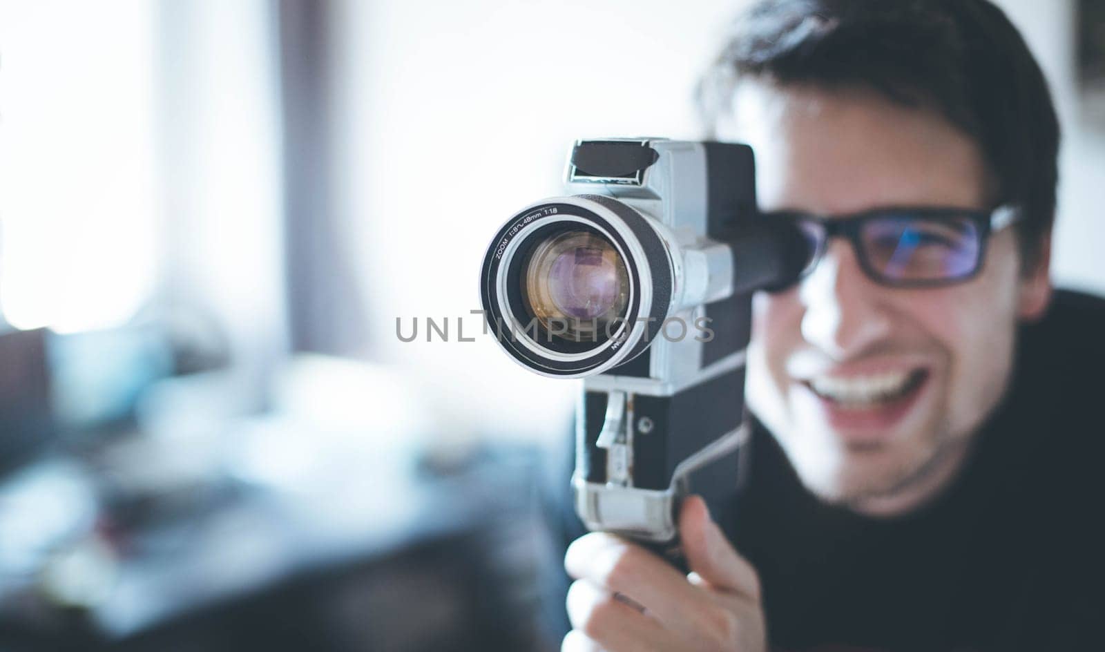 Filmmaker is doing a movie, vintage old movie camera