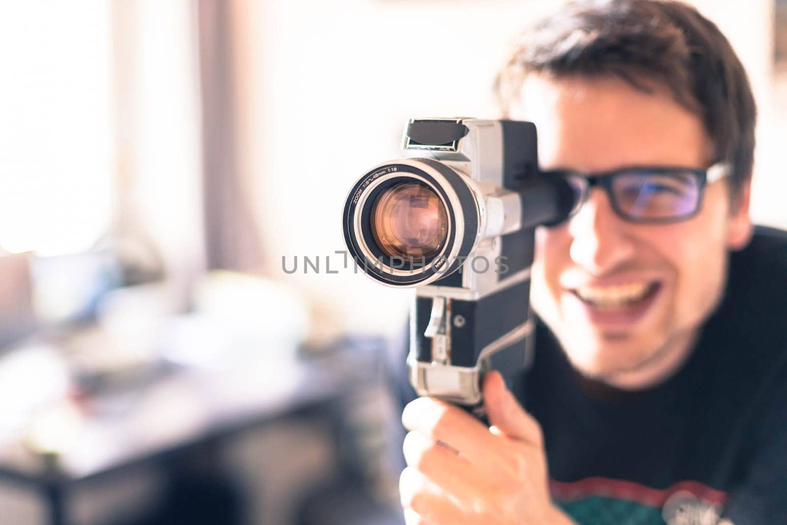 Filmmaker is doing a movie, vintage old movie camera