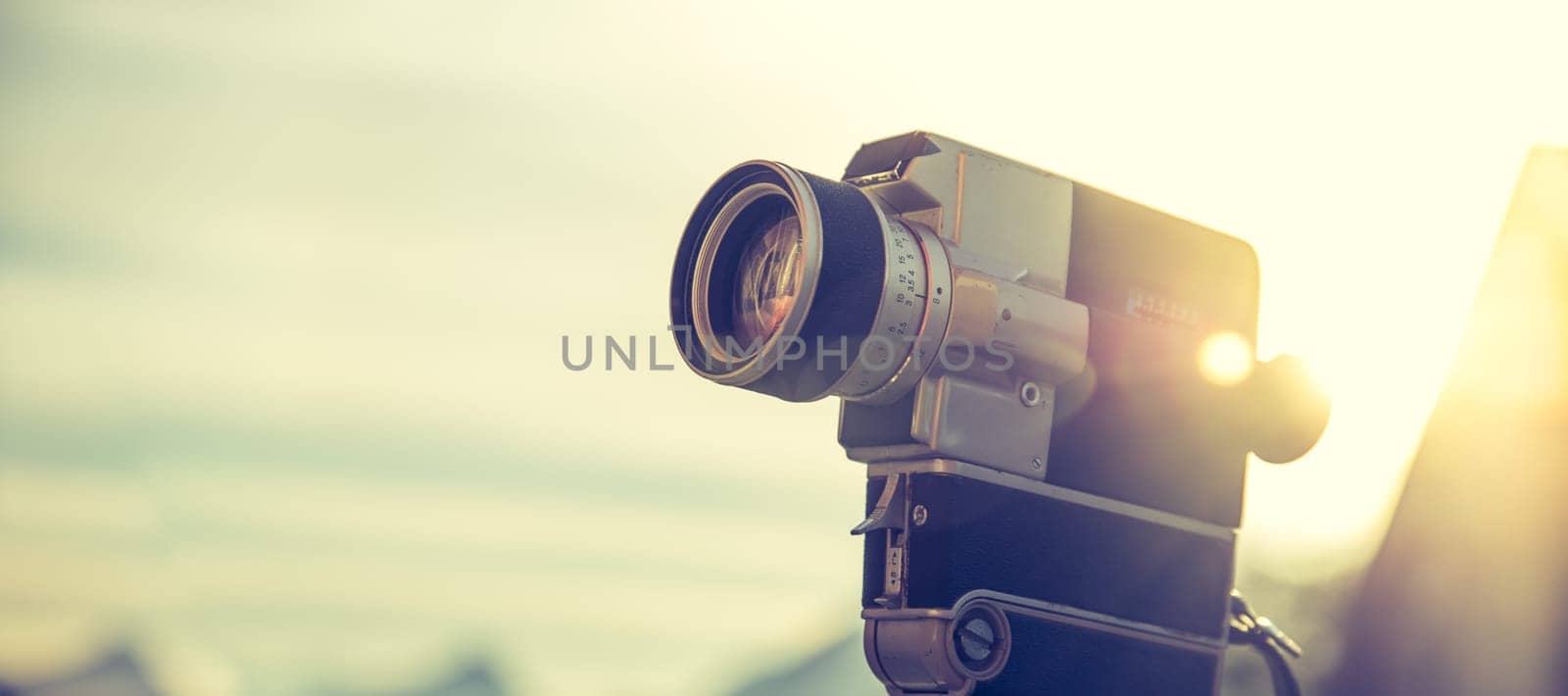 Vintage old movie camera, outdoor, sunset