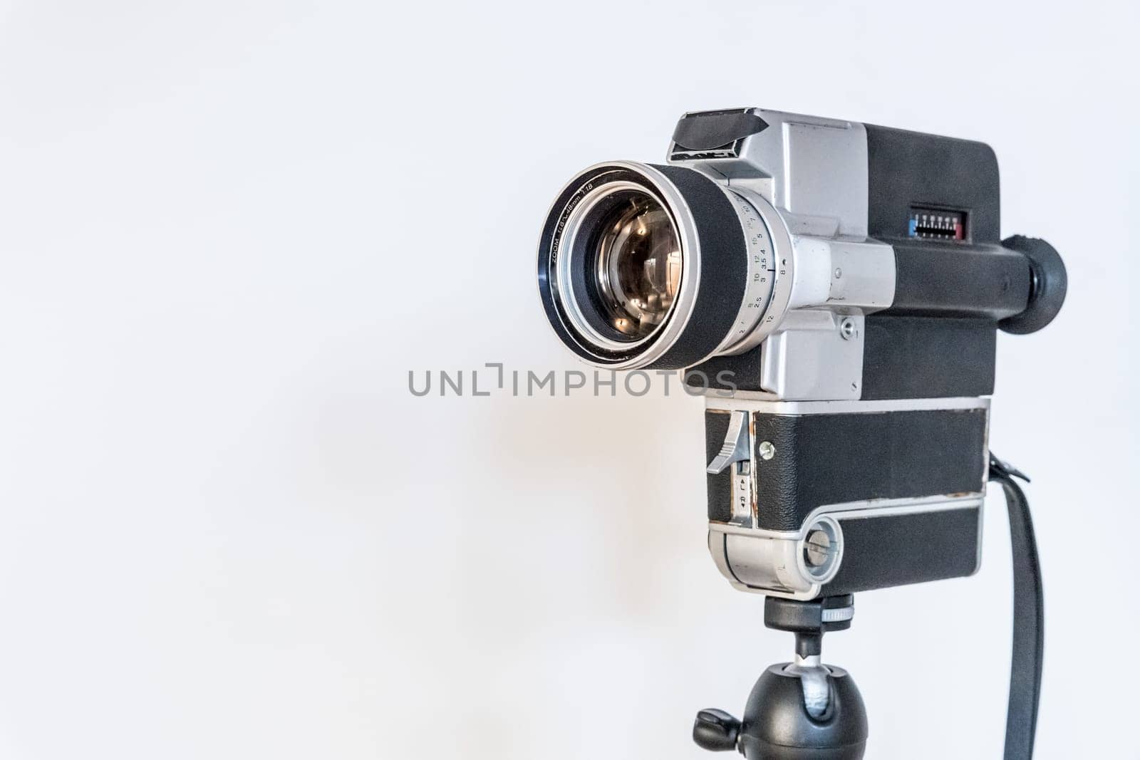Vintage old movie camera, white background