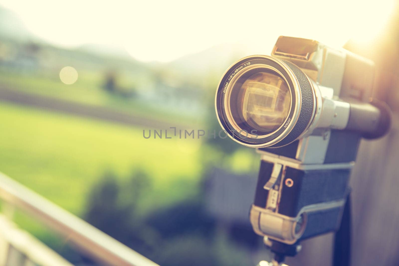 Vintage old movie camera, outdoor, sunset