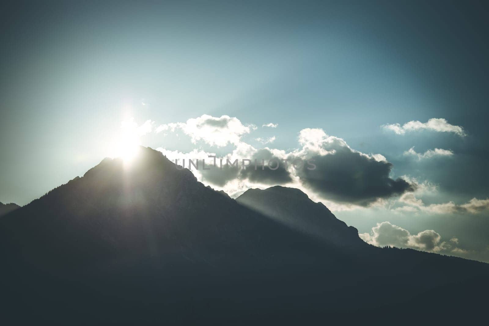 Sunset scenery on a mountain, cloudy sky