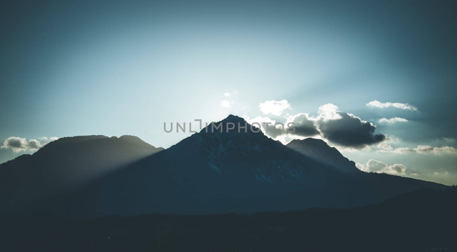 Sunset scenery on a mountain, cloudy sky