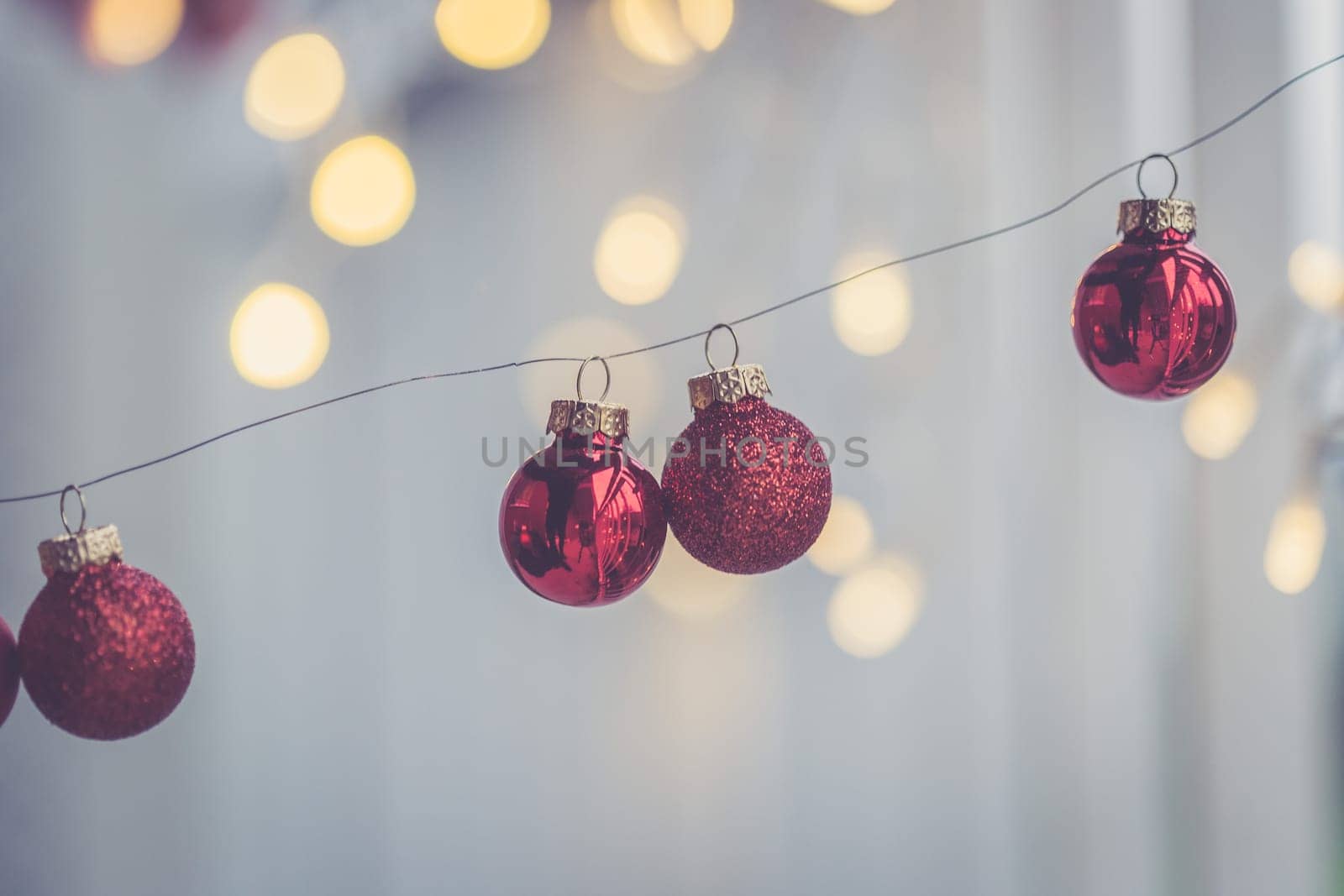 Red christmas baubles on a shiny blurry background