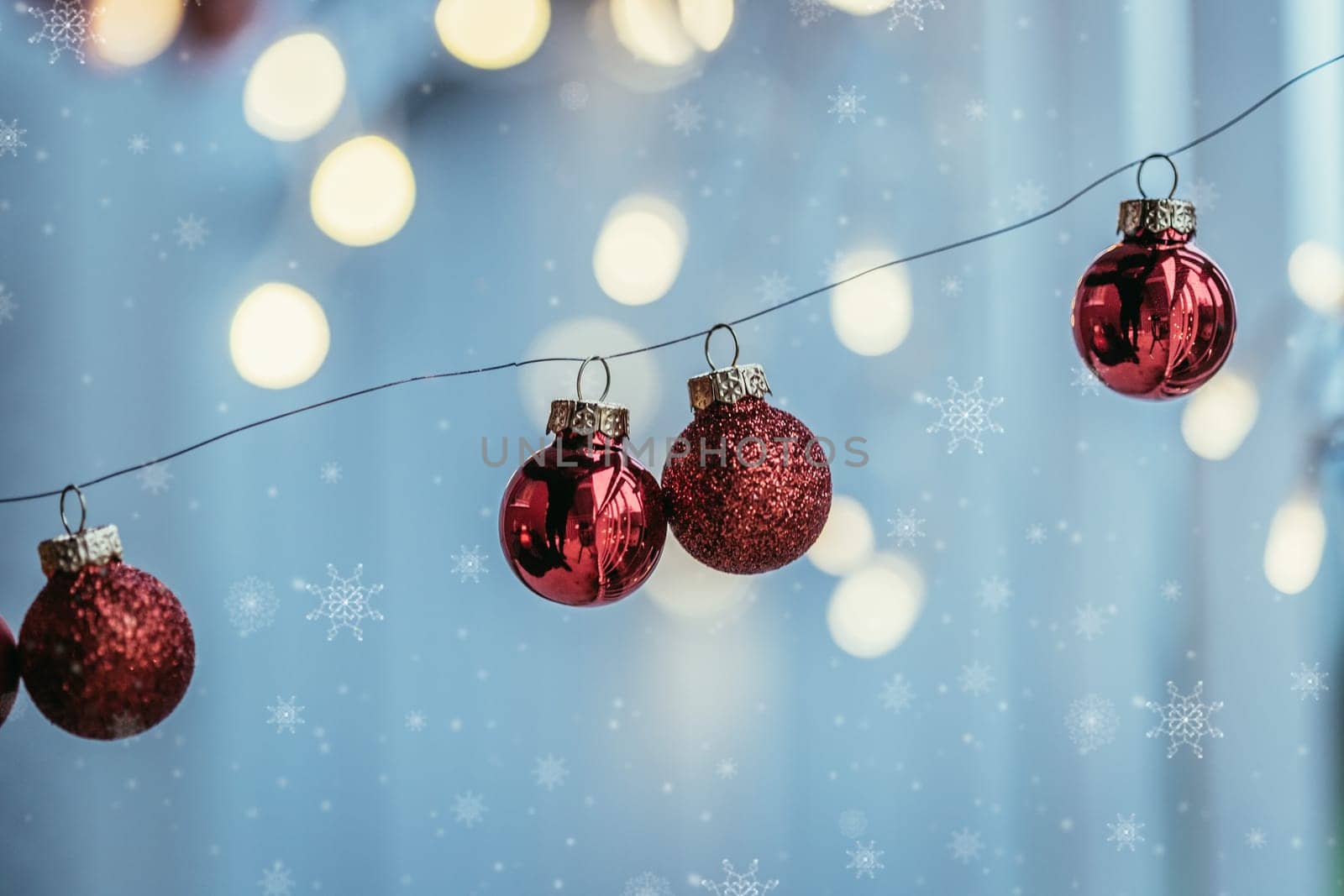 Red christmas baubles on a shiny blurry background
