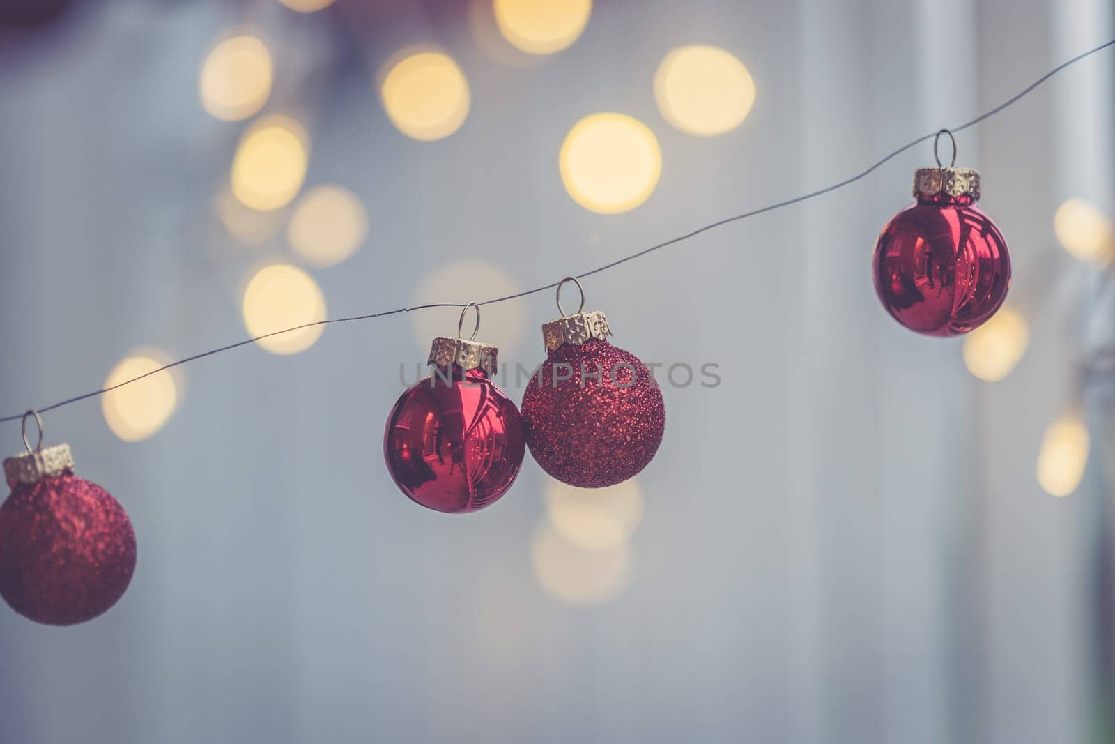 Red christmas baubles on a shiny blurry background