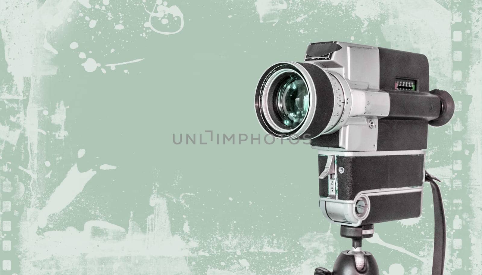 Vintage old movie camera, green design graphic with copy space