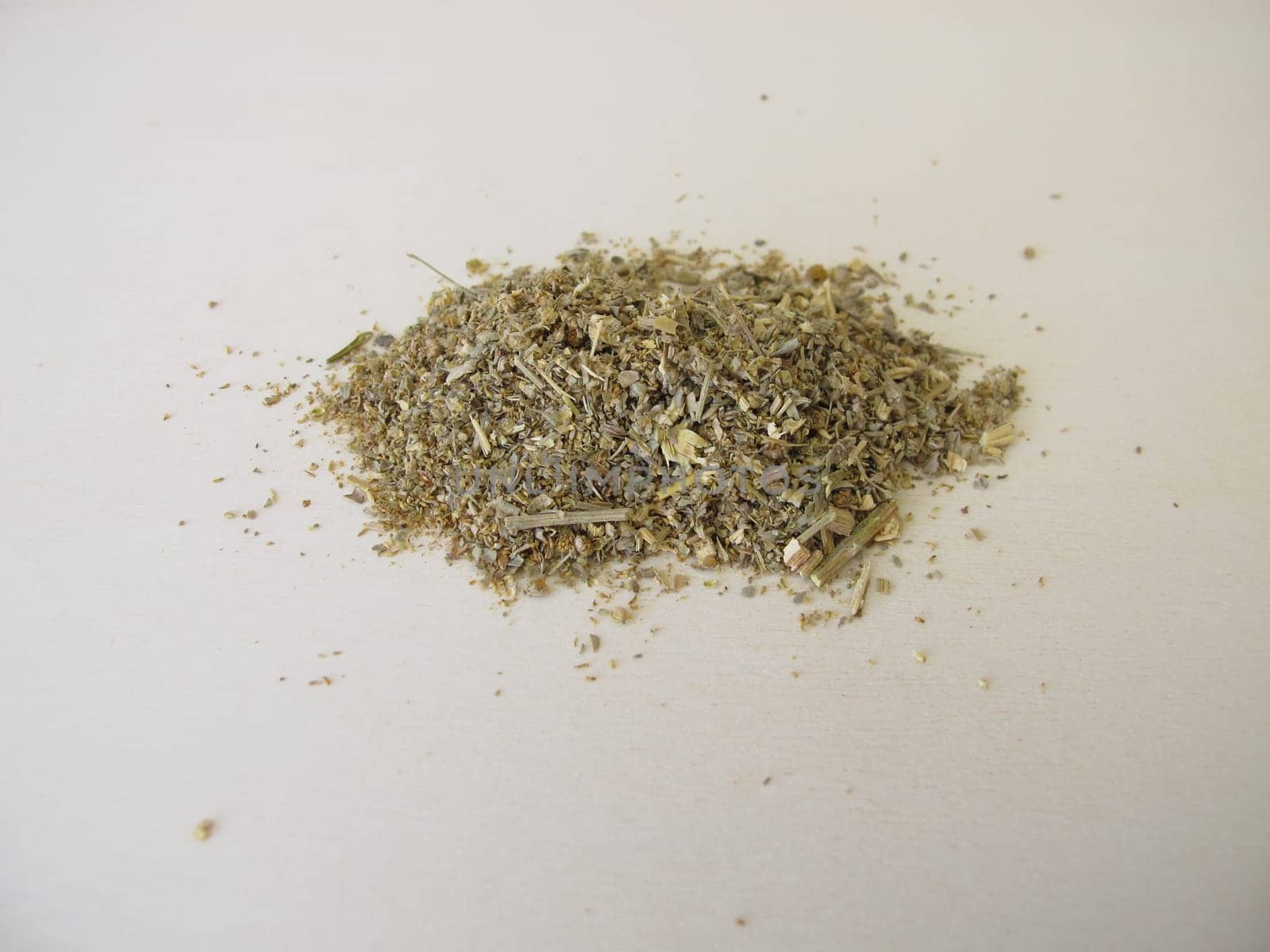 Dried absinthe wormwood herbs on a wooden board, Artemisia absinthium