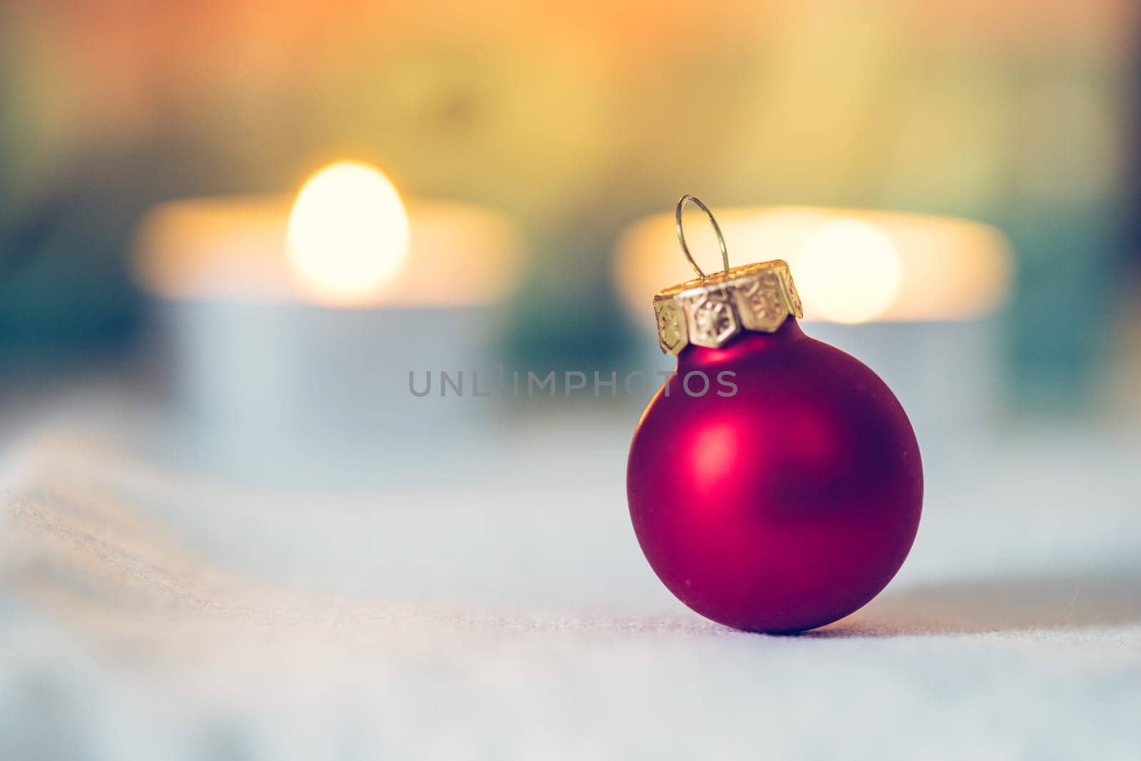 Christmas decoration: Close up of red Christmas baubles, advent calendar in the blurry background