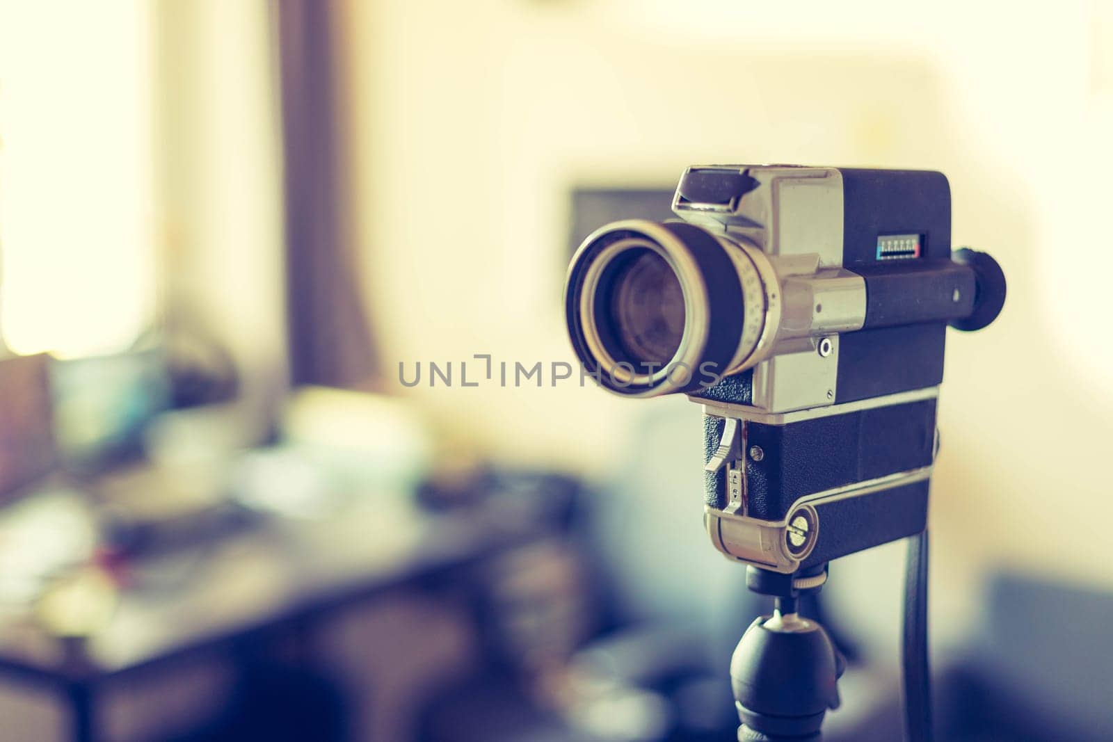 Vintage old movie camera indoor, copy space