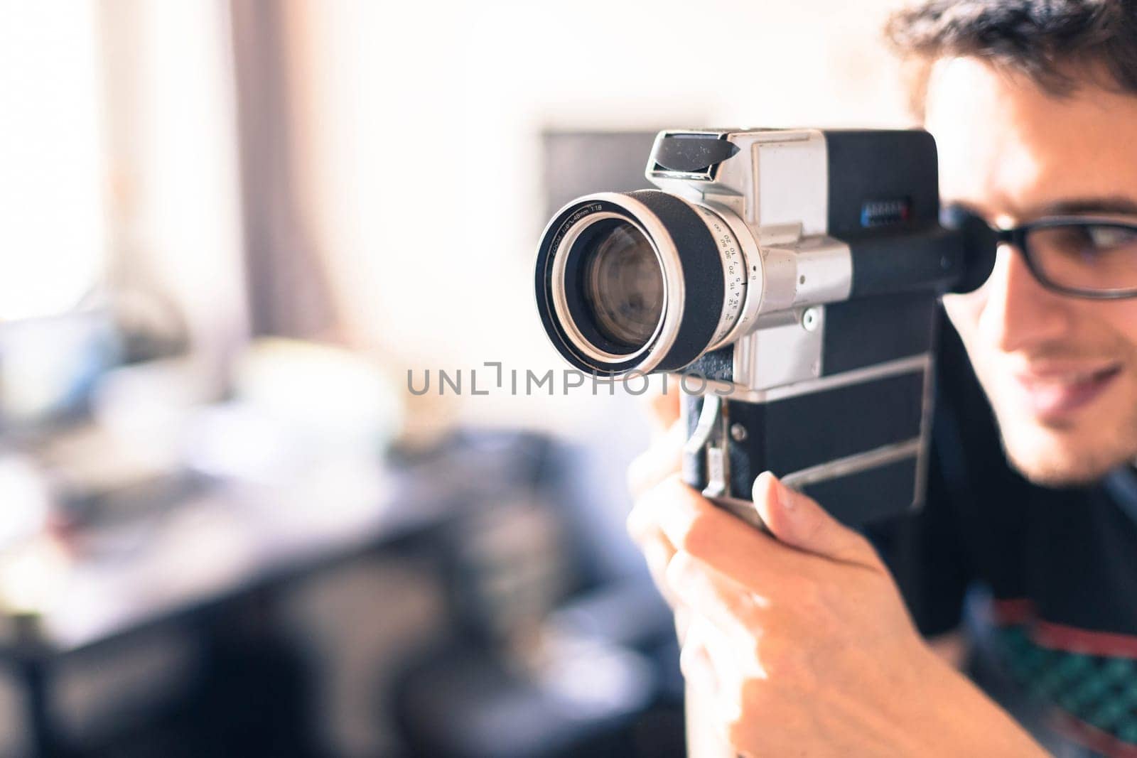 Filmmaker is doing a movie, vintage old movie camera