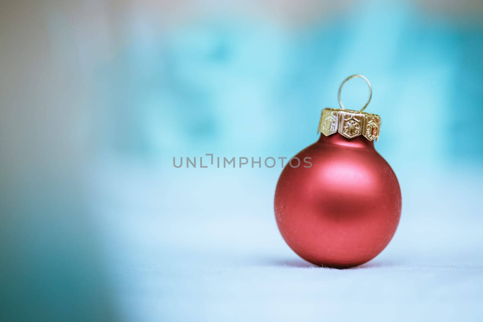 Christmas decoration: Close up of red Christmas baubles, advent calendar in the blurry background