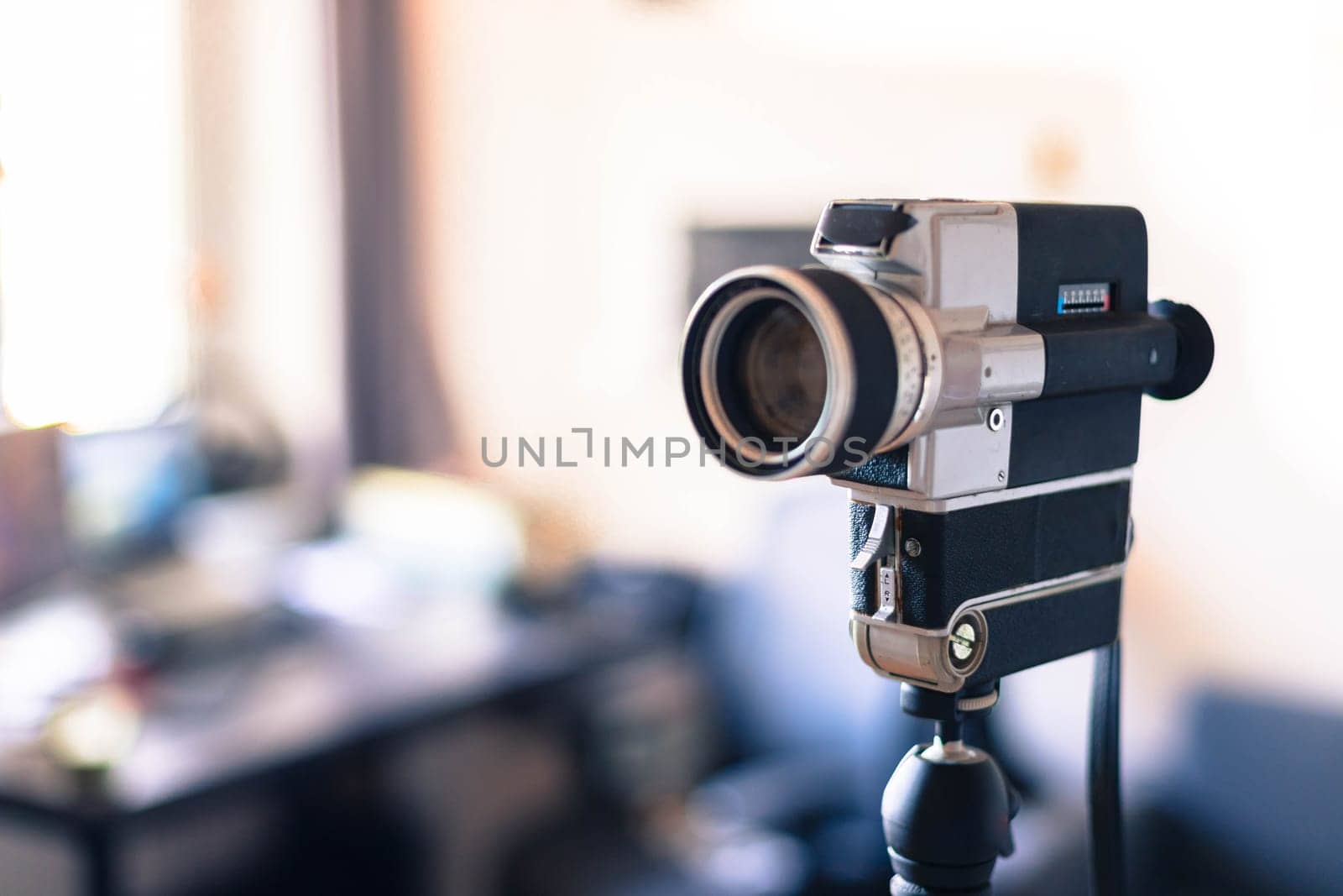 Vintage old movie camera indoor, copy space