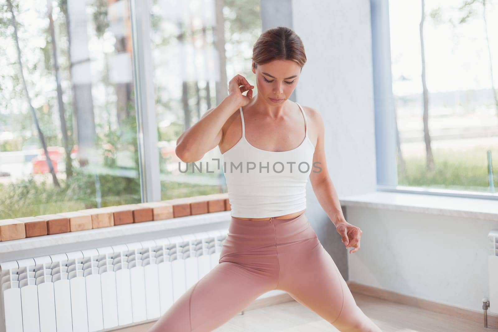 fitness and lifestyle concept - woman doing sports indoors.