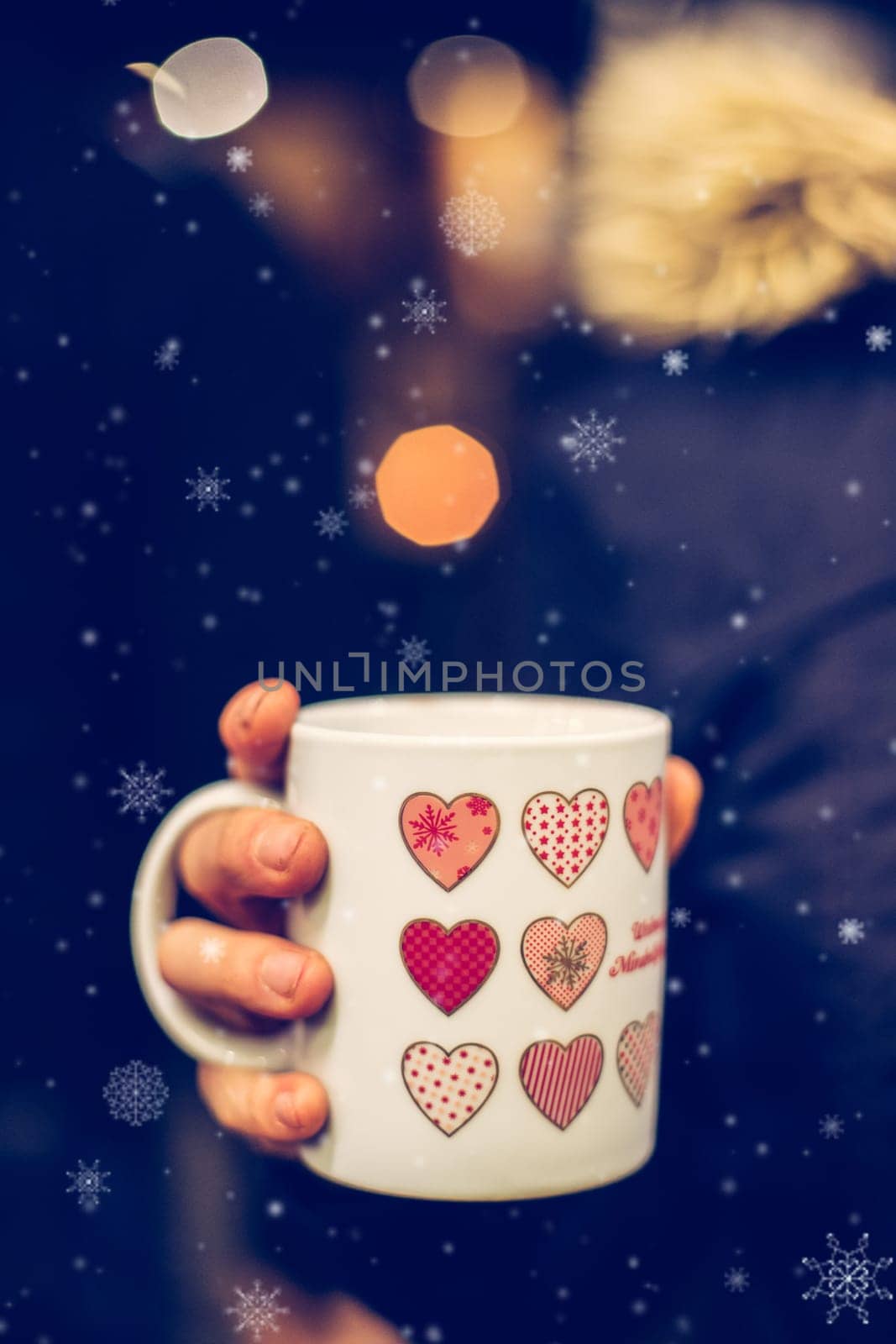 Enjoying Christmas time on the Christmas market. Close up of a cup of mulled wine.