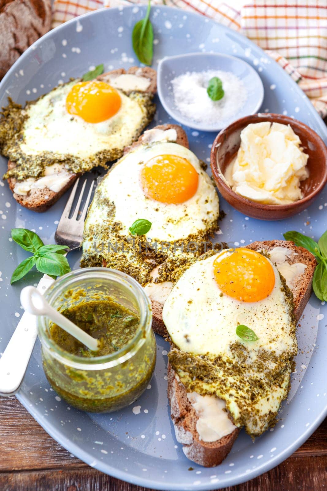 Pesto eggs, eggs, fried in basil pesto , sunny side up