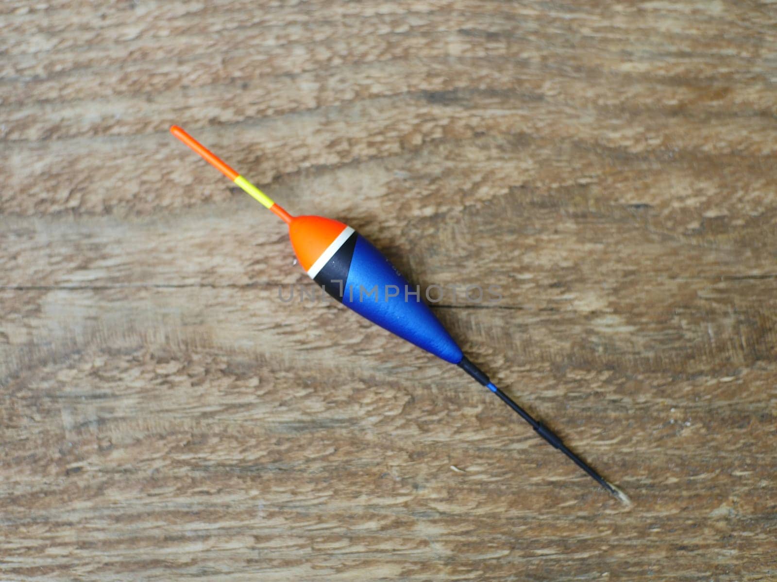 big red-blue float with a red antenna close-up, float for fishing, fishing accessories