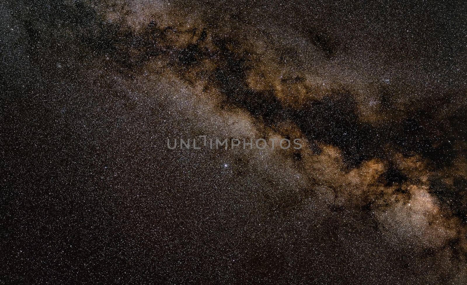 Night sky, many stars with milky way around Aquila constellation visible. Long exposure stacked photo.