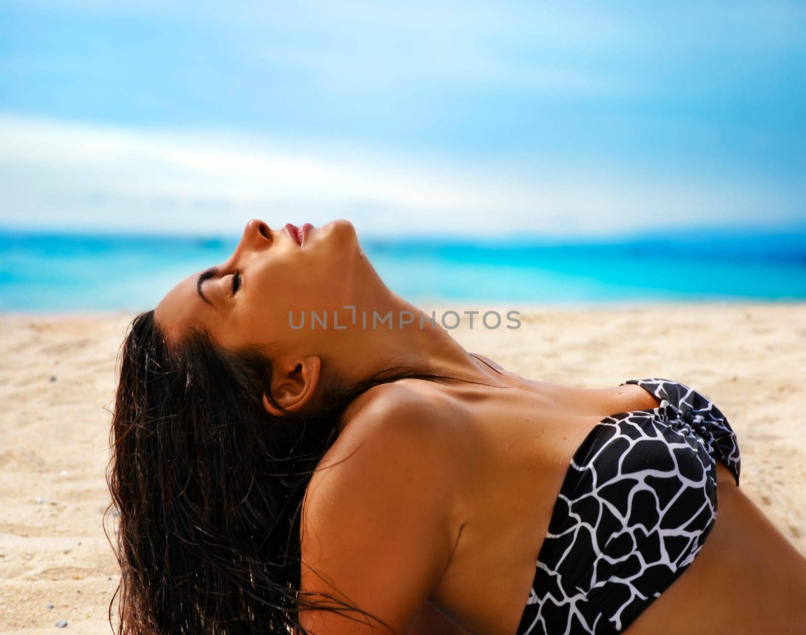 .Fashion shot of beautiful woman on the beach