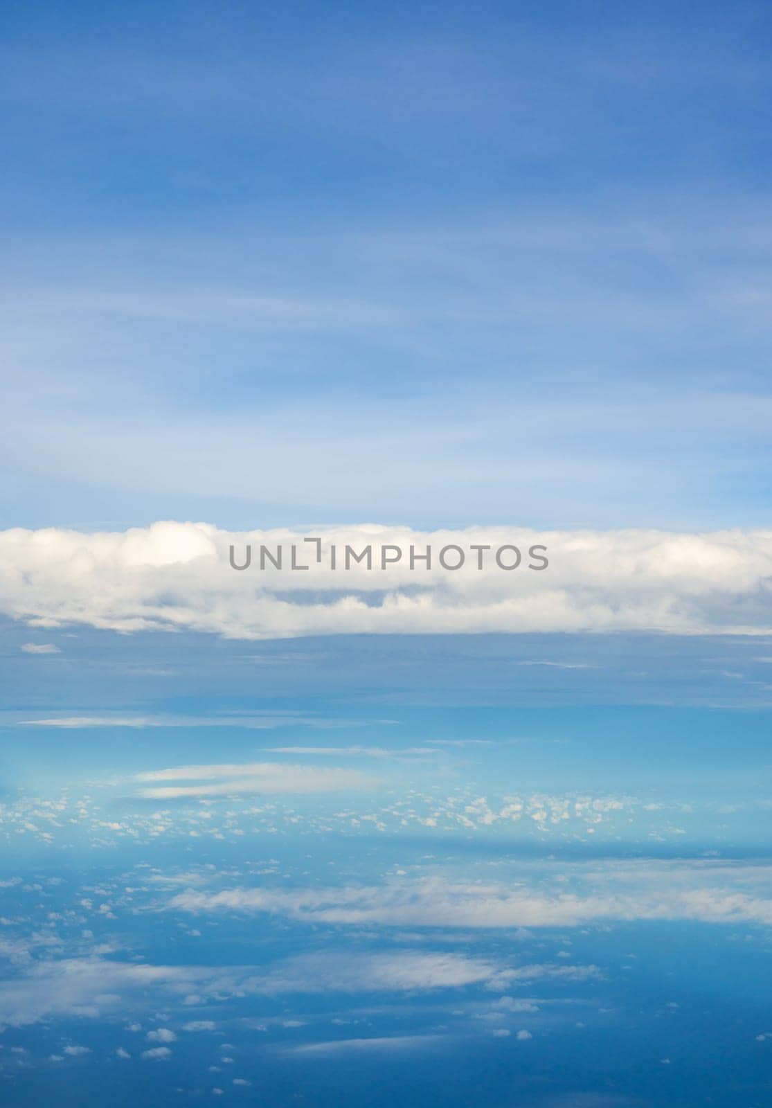 Cloudy blue sky taken from the airplane