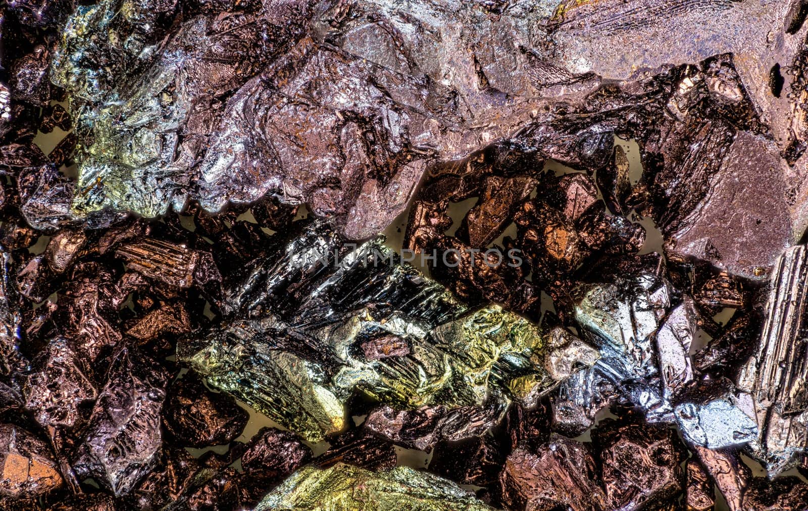 Potassium permanganate crystals under 1.5x magnification microscope - image width 23mm Abstract science background.