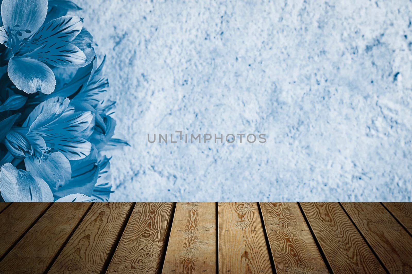 Background flowers on a textured stucco wall and blank wooden planks in the foreground. For product demonstrations, free space, layout, mockup, perspective board, background board.