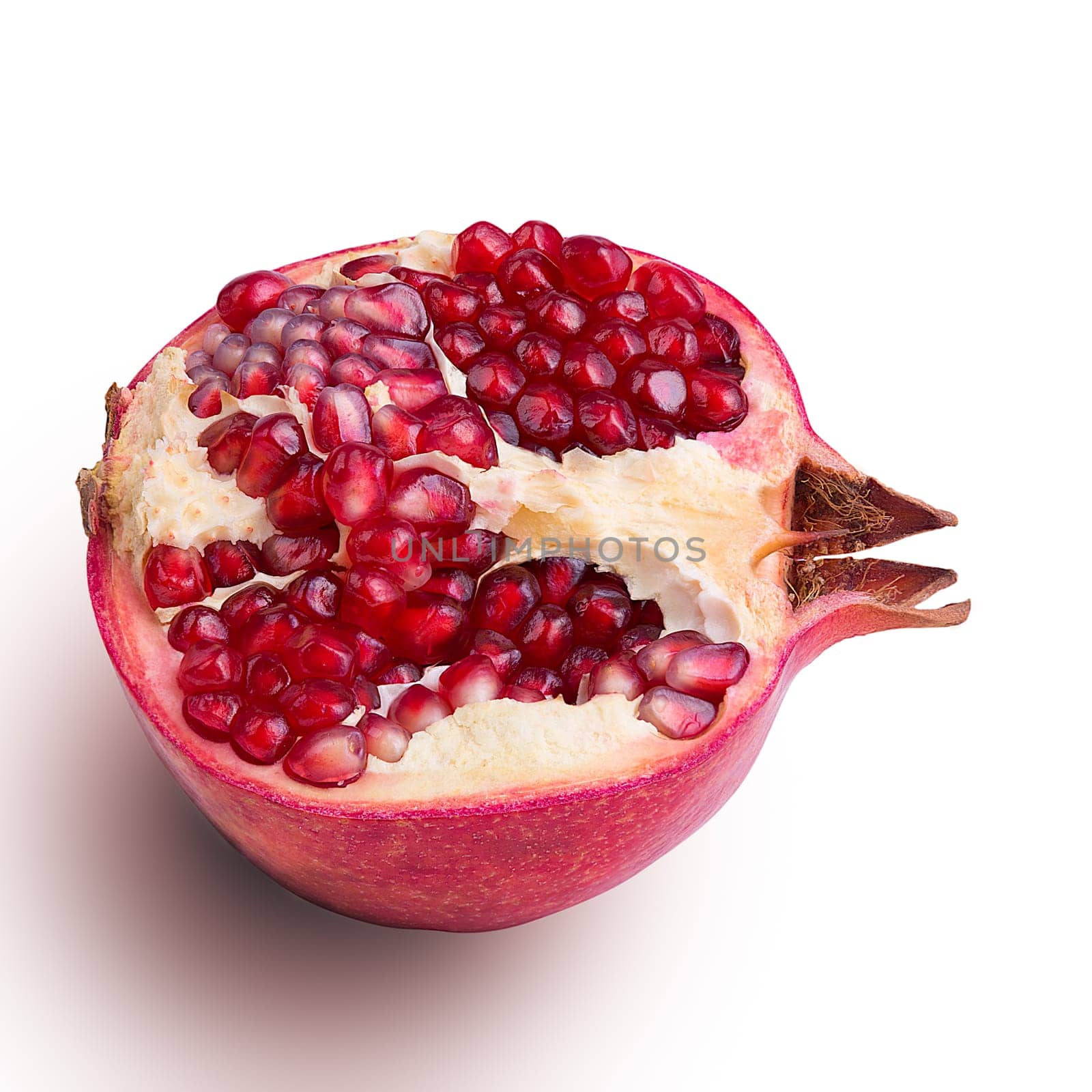 Garnet isolated part on a white background close-up with shadow. Fresh pomegranate. Juicy pomegranate. Delicious pomegranate. Place for advertising, logo, lettering, layout, mockup.