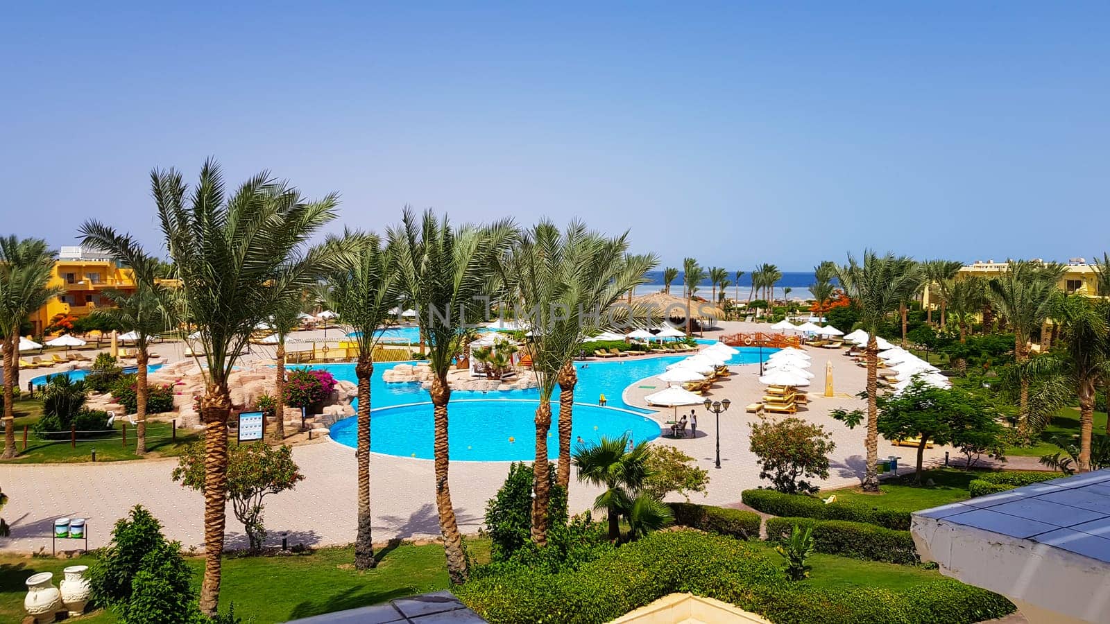 Sharm El Sheikh, Egypt - July 13, 2019: main pool and Amway territory. Luxurious hotel grounds. Landscaping and pool with sun loungers overlooking the sea. Hotel and spa in Sharm El Sheikh in Egypt.
