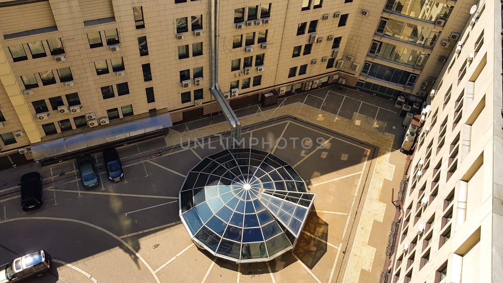 Ukraine, Kiev - August 16, 2019: aerial view of the office and residential complex of the business center. Yard, a number of windows, parking in the courtyard of the house. Unmanned photo