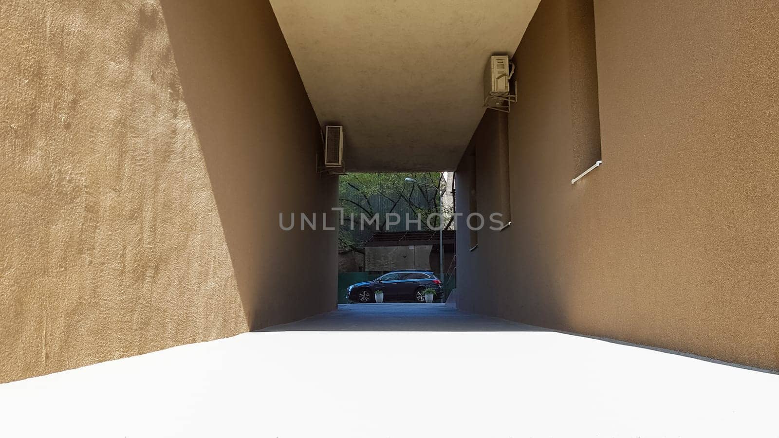 Entrance between two houses in a residential courtyard, the street of the historical center of Kiev. Architecture.