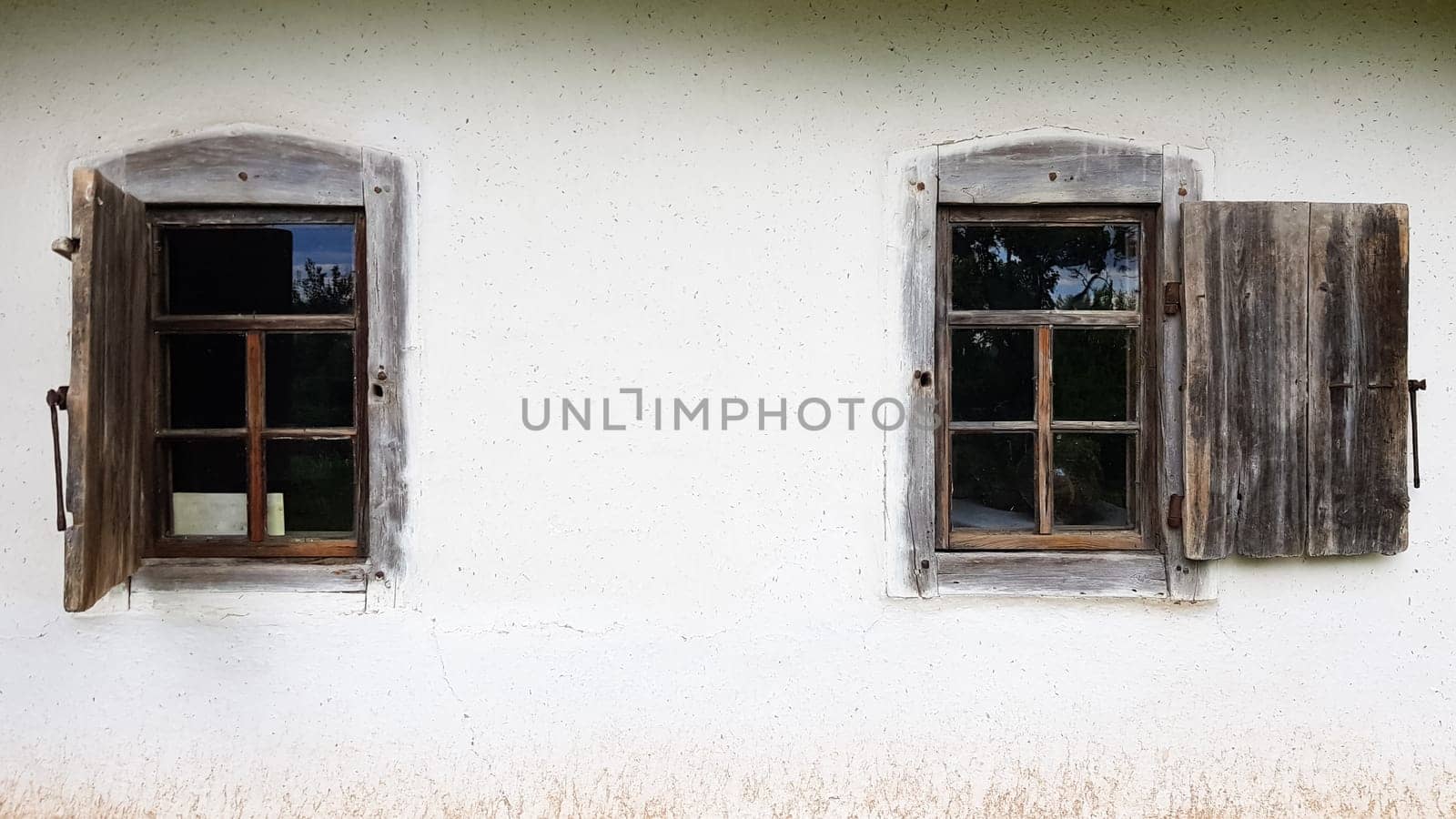Ukraine, Kiev - June 11, 2020. Old window in a vintage traditional peasant house in Ukraine. Antique wooden window frame. Pirogovo National Museum in the open air in Kiev. Copy space