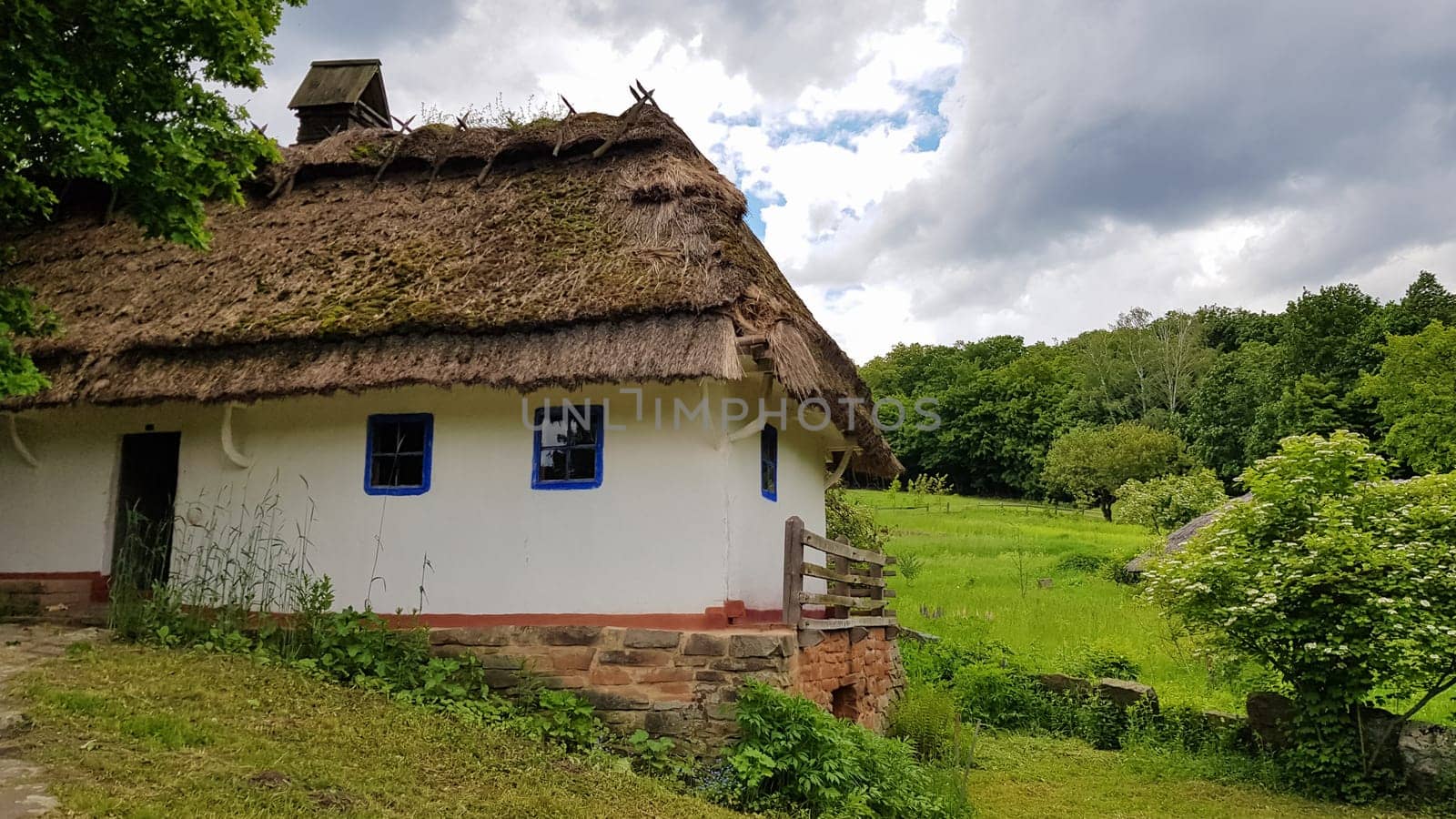 Ukraine, Kiev - June 11, 2020. The old house of peasants in the museum Pirogovo. National Museum of Folk Architecture and Everyday Life of Traditional Folklore Houses of Different Regions of Ukraine.