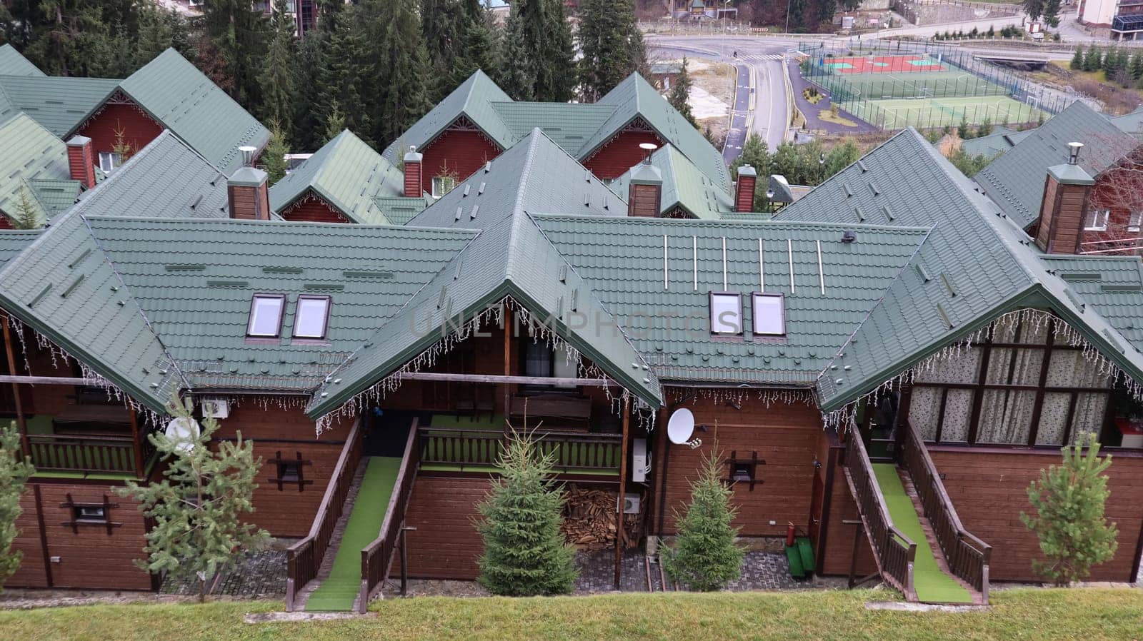 Bukovel ski resort in autumn aerial view. View of hotel houses in the ecological countryside against the background of spruce trees and mountain hills.Ukraine, Bukovel - November 20, 2019