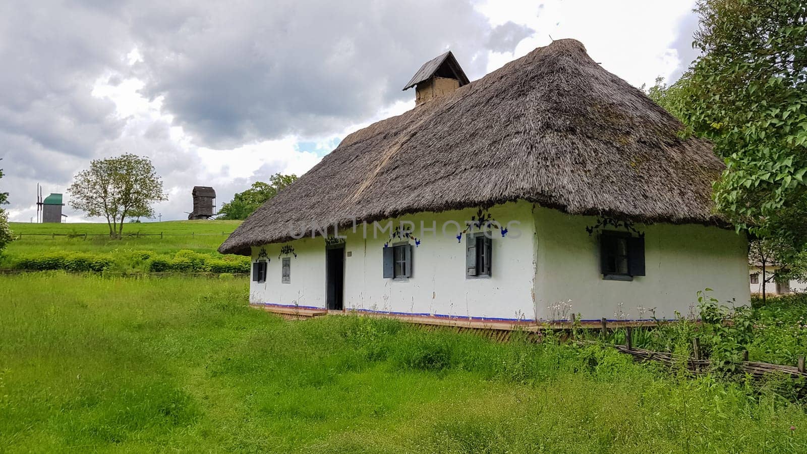 Ukraine, Kiev - June 11, 2020. The old house of peasants in the museum Pirogovo. National Museum of Folk Architecture and Everyday Life of Traditional Folklore Houses of Different Regions of Ukraine.