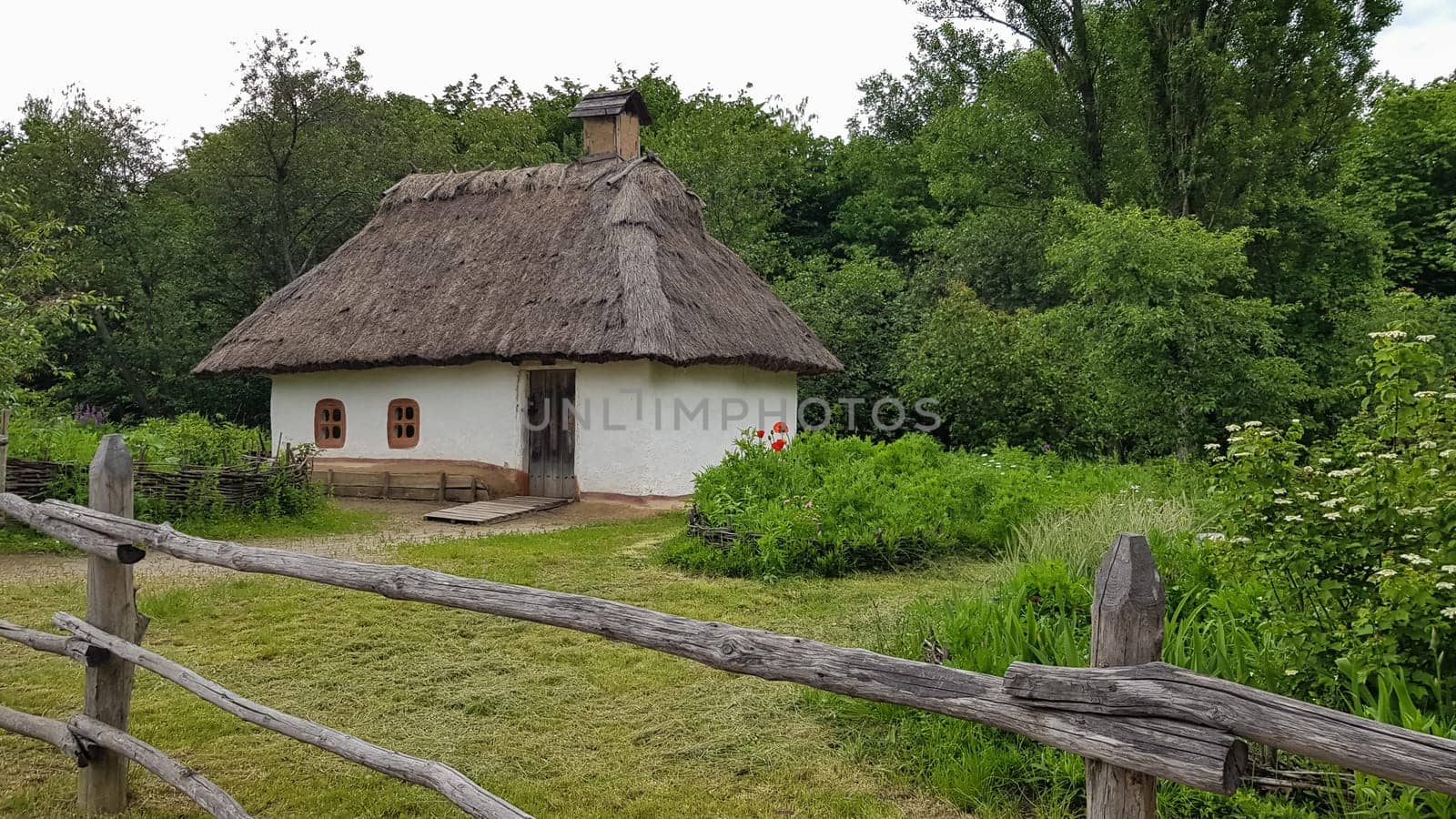 Ukraine, Kiev - June 11, 2020. The old house of peasants in the museum Pirogovo. National Museum of Folk Architecture and Everyday Life of Traditional Folklore Houses of Different Regions of Ukraine.