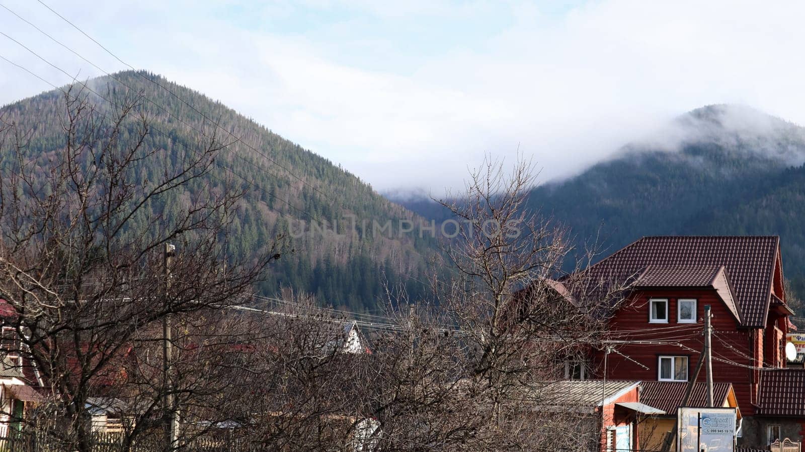 A small town or village of Yaremche among the Carpathians on an autumn afternoon. Ukraine, Yaremche - November 20, 2019
